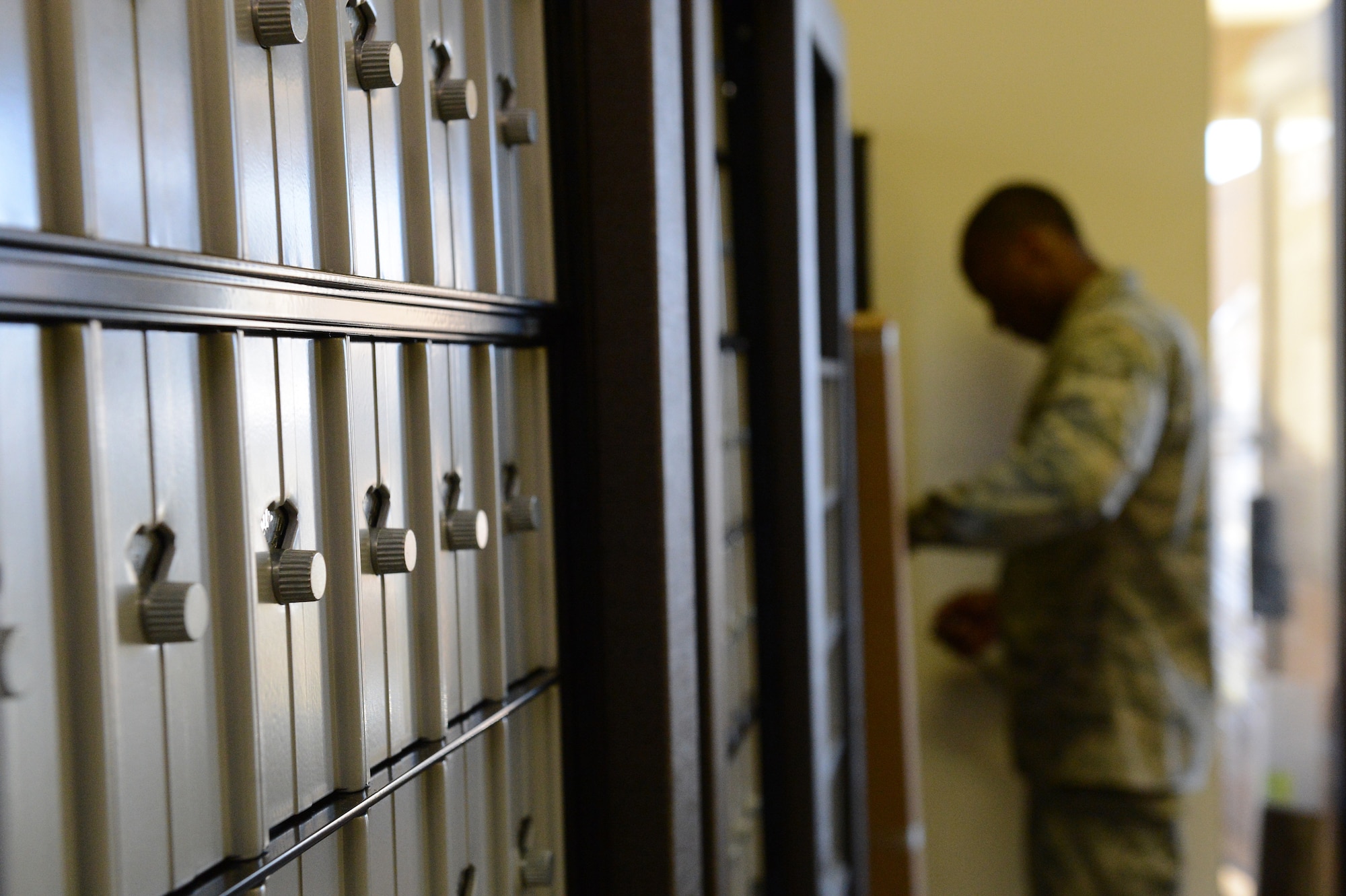 U.S. Air Force Airman 1st Class Dominque McNeal, 20th Communications Squadron network security technician, assembles mailboxes at the U.S. Post Office, Shaw Air Force Base, S.C., March 10, 2014. The mailboxes were built for r living in the dorms and will be open 24/7. (U.S. Air Force photo by Airman 1st Class Diana M. Cossaboom/Released)
