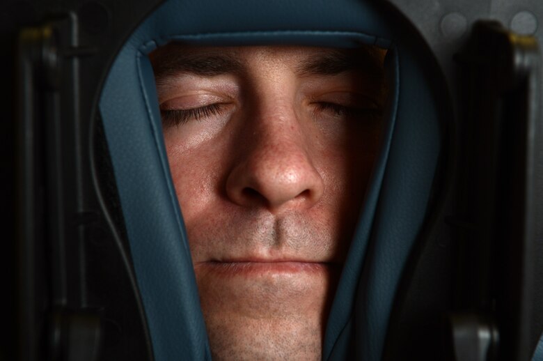 U.S. Air Force Tech. Sgt. Jason Andrews, 52nd Force Support Squadron operations manager from Henderson, Ky., lies face down on a massage table at Spangdahlem Air Base, Germany, March 14, 2014. Massages can help maintain a healthy well being when Airmen face mental, physical or spiritual stressors. (U.S. Air Force photo by Airman 1st Class Kyle Gese/Released)