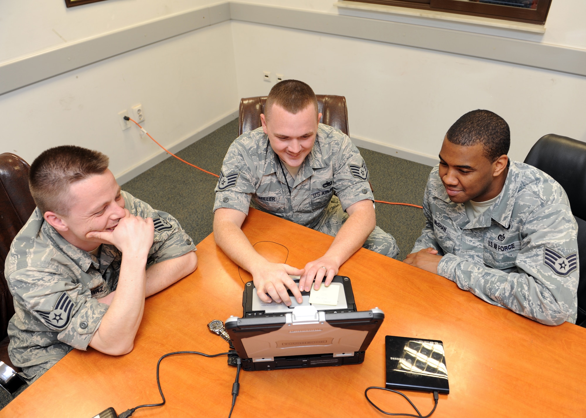 Staff Sgt. Chris Davaz, 39th Maintenance Squadron weapons flight inspector, Staff Sgt. Justin Miller, 39th MXS mission support flight inspector, and Christopher McShan II, 39th Civil Engineer Squadron readiness and emergency management flight technical order distribution office, review technical orders March 5, 2014, Incirlik Air Base, Turkey. The 39th MXS coordinates with many other agencies to do the right thing, at the right time. (U.S. Air Force photo by Senior Airman Chase Hedrick/Released)
