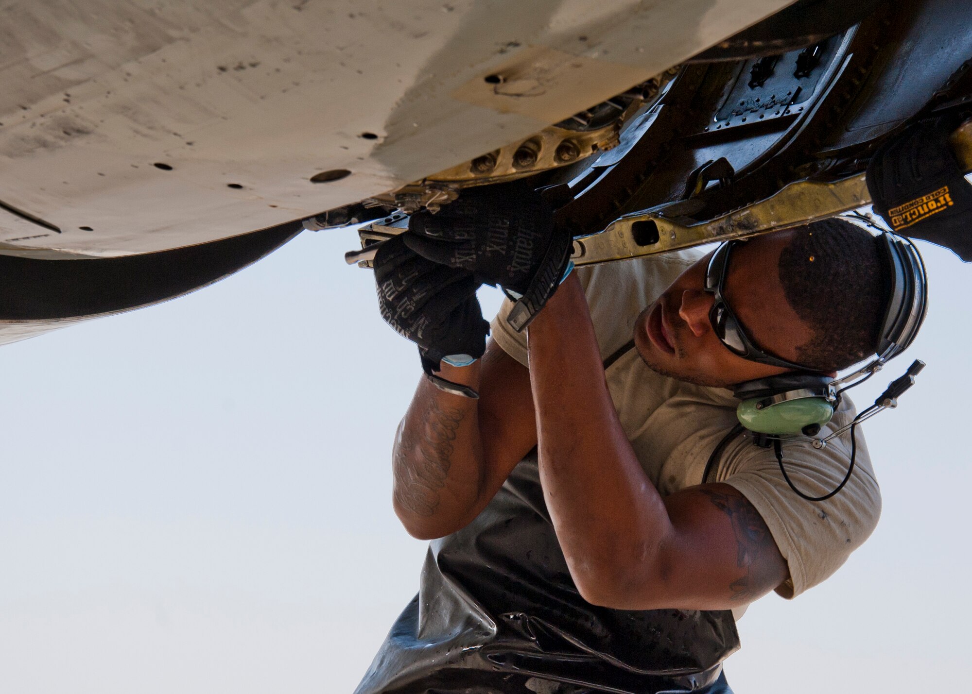 Air Force Senior Airman William Smith, 380th Expeditionary Aircraft Maintenance Squadron Sentry Aircraft Maintenance Unit E-3 engines technician, services an integrated drive generator on an E-3 Sentry at an undisclosed location in Southwest Asia, March 12, 2014. Smith is a native of Phoenix, Ariz., and is deployed from Tinker Air Force Base, Okla. (U.S. Air Force photo by Staff Sgt. Michael Means/Released)