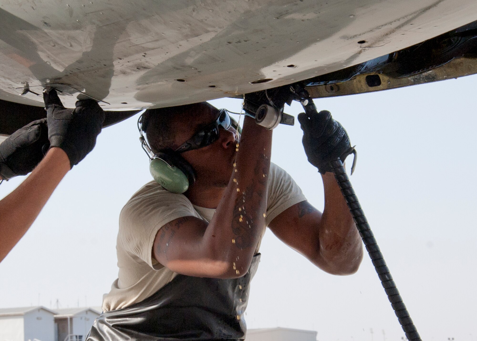 Air Force Senior Airman William Smith, 380th Expeditionary Aircraft Maintenance Squadron Sentry Aircraft Maintenance Unit E-3 engines technician, services an integrated drive generator on an E-3 Sentry at an undisclosed location in Southwest Asia, March 12, 2014. Smith is a native of Phoenix, Ariz., and is deployed from Tinker Air Force Base, Okla. (U.S. Air Force photo by Staff Sgt. Michael Means/Released)