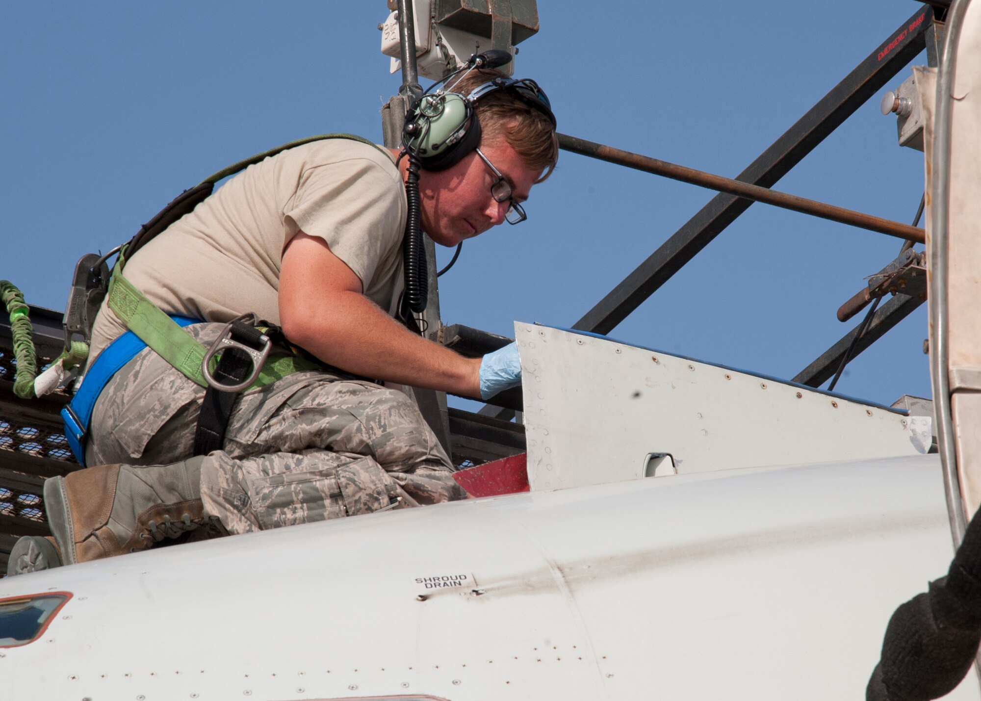 Air Force Senior Airman Jason Witmer, 380th Expeditionary Aircraft Maintenance Squadron Sentry Aircraft Maintenance Unit E-3 fuels technician, installs a pitot static probe cover on an E-3 Sentry at an undisclosed location in Southwest Asia, March 12, 2014. Witmer is a native of Nuevo, Calif., and is deployed from Tinker Air Force Base, Okla. (U.S. Air Force photo by Staff Sgt. Michael Means/Released)