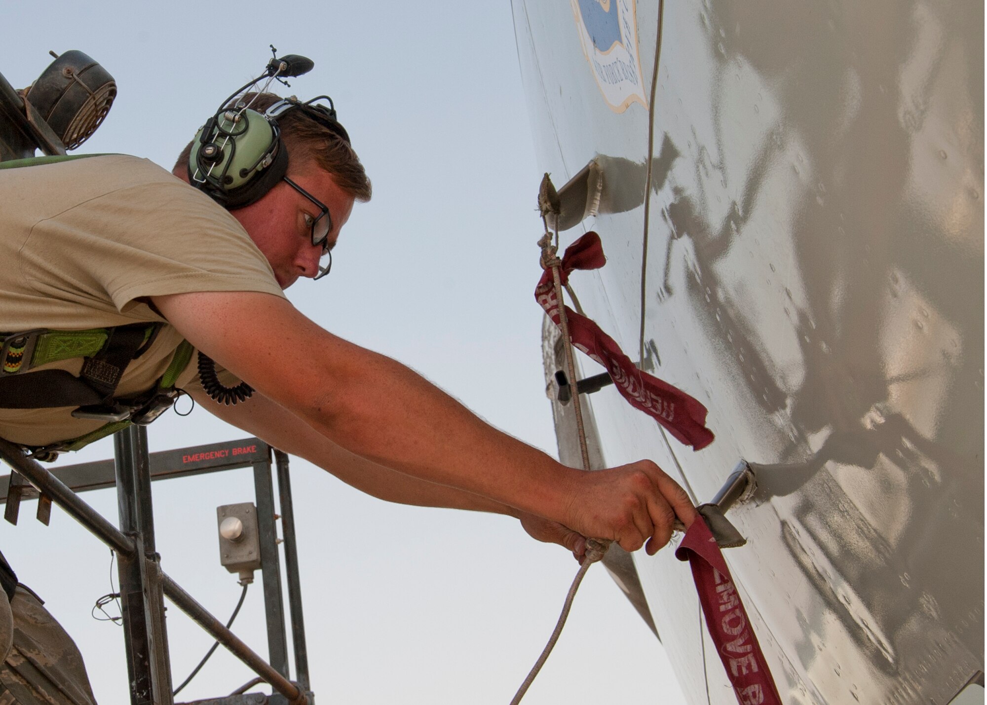 Air Force Senior Airman Jason Witmer, 380th Expeditionary Aircraft Maintenance Squadron Sentry Aircraft Maintenance Unit E-3 fuels technician, installs a pitot static probe cover on an E-3 Sentry at an undisclosed location in Southwest Asia, March 12, 2014. Witmer is a native of Nuevo, Calif., and is deployed from Tinker Air Force Base, Okla. (U.S. Air Force photo by Staff Sgt. Michael Means/Released)