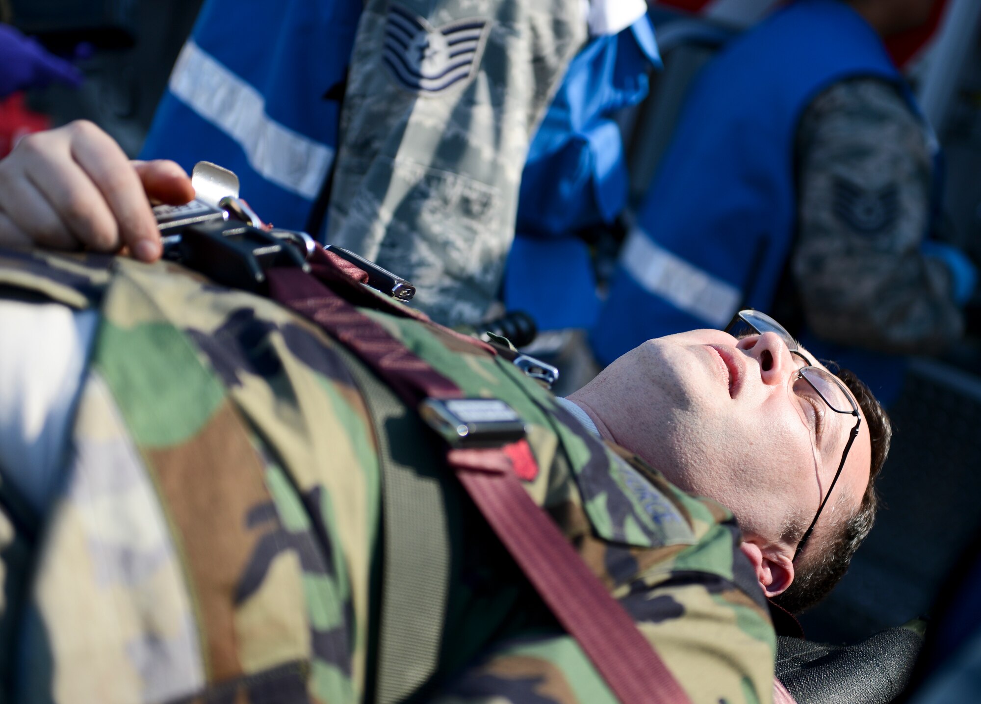 A mass casualty training victim simulates a state of unconsciousness March 13, 2014, Ramstein Air Base, Germany. The 86th Medical Group hosted a mass casualty training to familiarize first responders with the scene of a disaster or a catastrophe. (U.S. Air Force Photo/Airman 1st Class Michael Stuart)