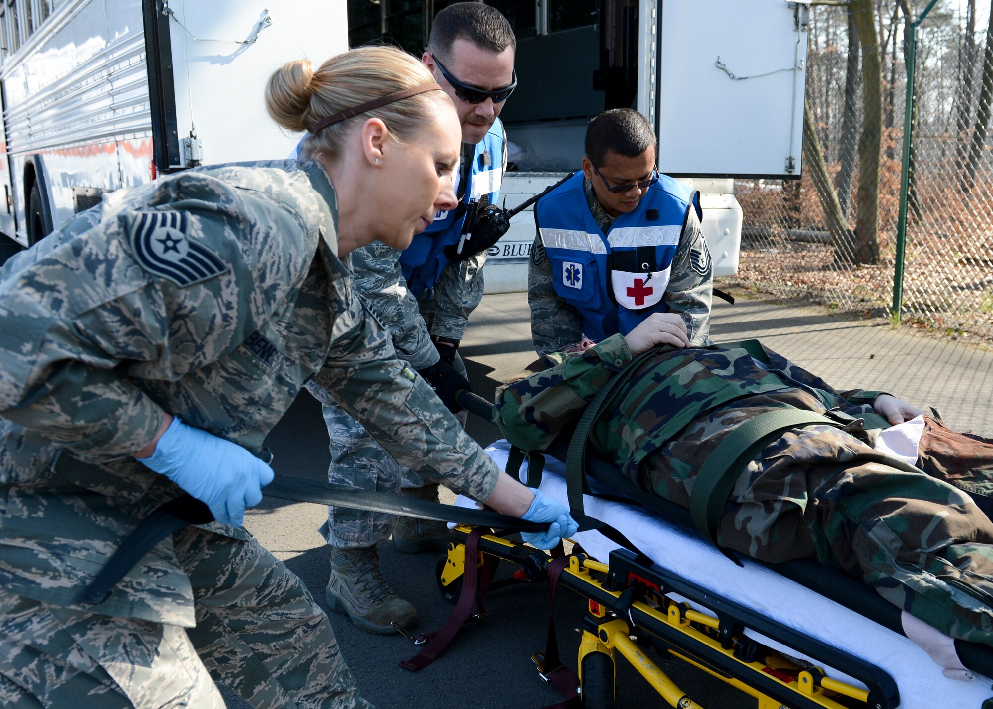 A team of first responders simulate immediate emergency care for a patient who has been injured during a mass casualty exercise March 13, 2014, Ramstein Air Base, Germany. The 86th Medical Group conducted a 3-hour mass casualty exercise to acquaint first responders with a scenario similar to a real-life situation. Multiple squadrons from the medical group participated in the training. (U.S. Air Force Photo/Airman 1st Class Michael Stuart)