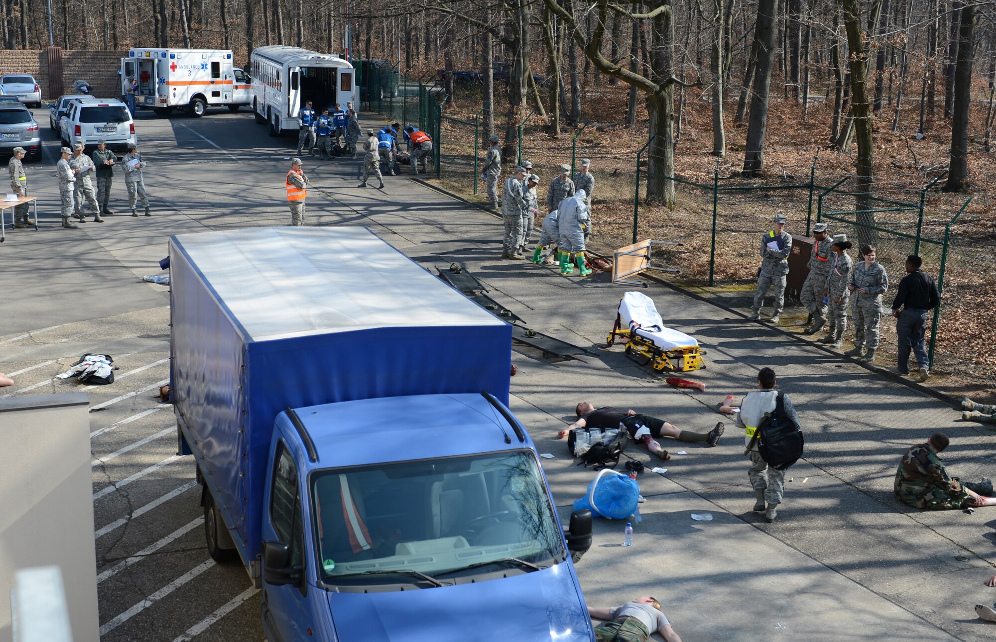 During a mass casualty exercise members of the 86th Medical Group treat simulated patients during a simulated catastrophic event March 13, 2014, Ramstein Air Base, Germany. The 86th Medical Group conducted a 3-hour mass casualty exercise to acquaint first responders with a scenario similar to a real-life situation. Multiple squadrons from the medical group participated in the training. (U.S. Air Force Photo/Airman 1st Class Michael Stuart)