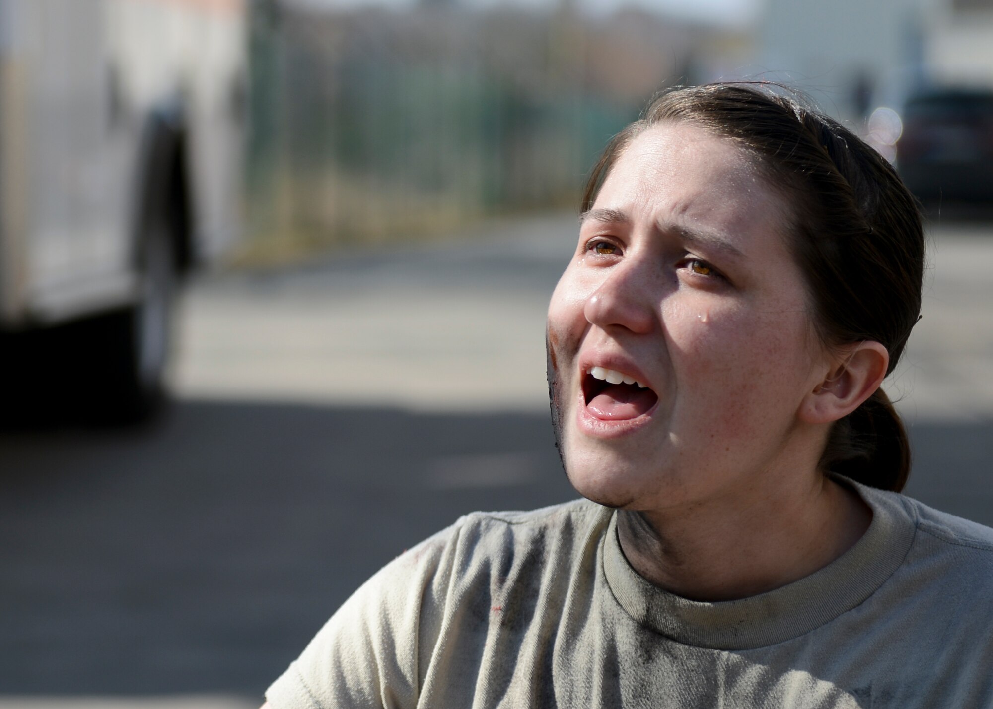 A mass casualty training victim simulates a cry of agony March 13, 2014, Ramstein Air Base, Germany during a training exercise. The 86th Medical Group hosted a mass casualty training to familiarize first responders with the scene of a disaster or a catastrophe. (U.S. Air Force Photo/Airman 1st Class Michael Stuart)