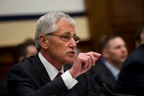Secretary of Defense Chuck Hagel, Chairman of the Joint Chiefs of Staff General Martin Dempsey, and Department of Defense Comptroller Robert Hale testify before the House Armed Service Committee at the Rayburn House Office Building in Washington D.C. on March 6, 2014. Hagel addressed the 2015 Department of Defense Budget Proposal as remarked on the steps the Department has taken to separate itself from military cooperations with Russia in response to the situation in Ukraine.