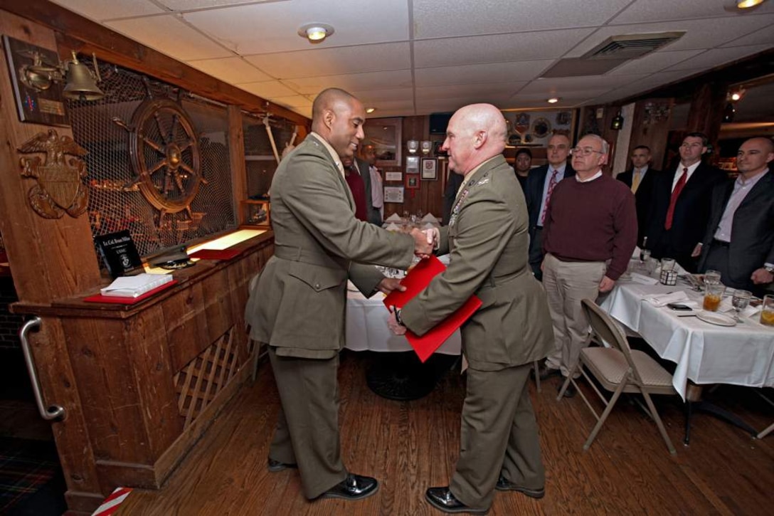 U.S. Marine, Lt. Col. Bian L. Milan, Marine Corps Information Operations Center, retires from active duty at the Globe and Laurel, Stafford, Virginia, Feb. 20, 2014. (U.S Marine Corps photo by Sgt Kristofer Atkinson/Released)