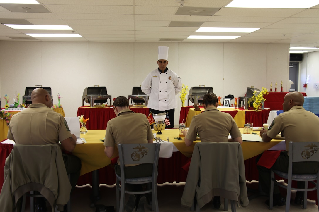 Pfc. Brandon Ruiz stands before a panel of judges during the annual Chef of the Quarter competition at Marine Corps Air Station Cherry Point's mess hall March 14. The competition featured three food service specialists with Marine Wing Support Squadron 271 and MWSS-274 vying for the Chef of the Quarter title. Ruiz is a food service specialist with MWSS-271.