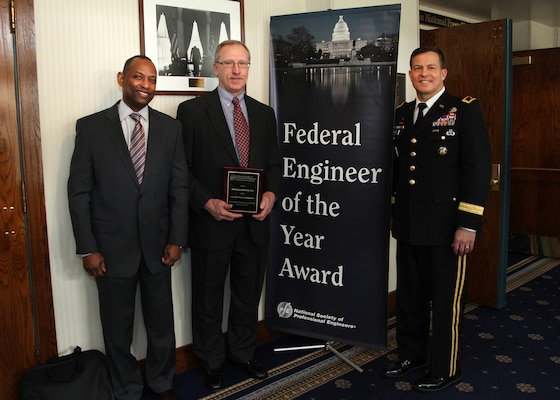 Maj. Gen. John W. Peabody (Right), U.S. Army Corps of Engineers deputy commanding general for Civil and Emergency Operations, and James C. Dalton (Left), USACE chief of Engineering and Construction, pose with Mike Zoccola, chief of the Nashville District Civil Design Branch, during the Federal Engineer of the Year Banquet Feb. 20, 2014 at the National Press Club in Washington D.C.  Zoccola, the 2013 Corps of Engineers Engineer of the Year, was honored as one of 10 finalists for the FEYA by the National Society of Professional Engineers.