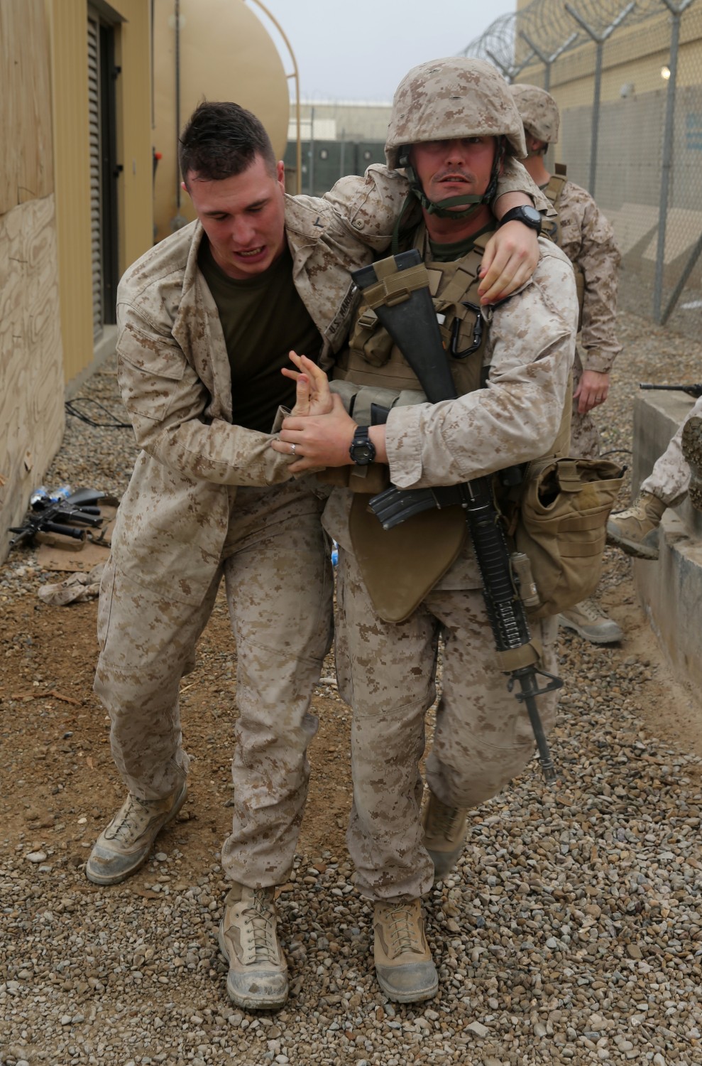 Petty Officer 2nd Class Daryl Hermansen, corpsman, Headquarters and Service Company, 1st Battalion, 7th Marine Regiment, and a native of Philadelphia, evacuates a simulated casualty during a training drill aboard Camp Leatherneck, Afghanistan, March 14, 2014. The drill was designed to ensure accountability of all personnel and gear while practicing movement to muster locations in the event of an emergency. The battalion had Navy corpsmen with 3rd Battalion, 7th Marine Regiment, evaluate the service members as they reacted to the situation. “I think it was vital to establish a baseline of our reactions,” said Petty Officer 1st Class Jeson Hall, a corpsman with 1st Bn., 7th Marines, and a native of Florence, Ala. “Establishing a baseline give us measures for success so we can continue to improve during future drills.” (U.S. Marine Corps photo by Cpl. Joseph Scanlan)