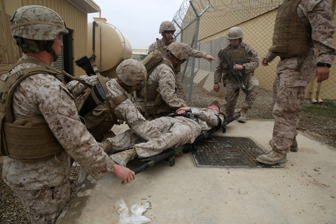 Marines and Navy corpsmen with Headquarters and Service Company, 1st Battalion, 7th Marine Regiment, treat a simulated casualtie during a training drill aboard Camp Leatherneck, Afghanistan, March 14, 2014. The drill was designed to ensure accountability of all personnel and gear while practicing movement to muster locations in the event of an emergency. The battalion had Navy corpsmen with 3rd Battalion, 7th Marine Regiment, evaluate the service members as they reacted to the situation. “I think it was vital to establish a baseline of our reactions,” said Petty Officer 1st Class Jeson Hall, a corpsman with 1st Bn., 7th Marines, and a native of Florence, Ala. “Establishing a baseline give us measures for success so we can continue to improve during future drills.” (U.S. Marine Corps photo by Cpl. Joseph Scanlan)