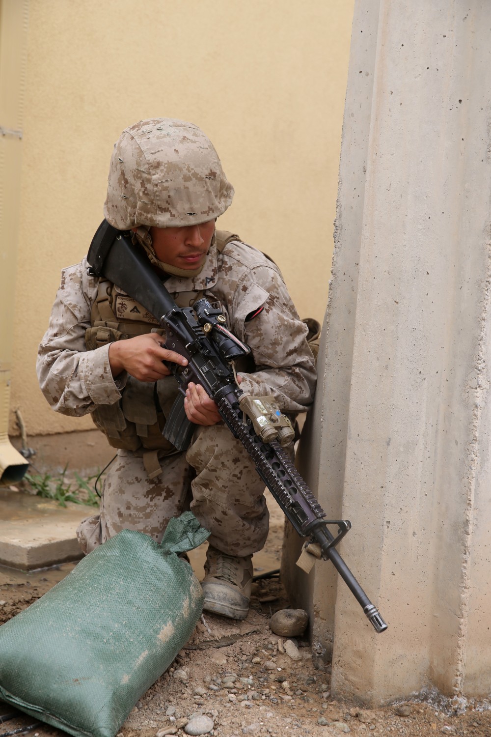 Lance Cpl. Jose Rodriguez, intelligence analyst, Headquarters and Service Company, 1st Battalion, 7th Marine Regiment, and a native of Wilmington, Del., provides security as Navy corpsmen treat simulated casualties during a training drill aboard Camp Leatherneck, Afghanistan, March 14, 2014. The drill was designed to ensure accountability of all personnel and gear while practicing movement to muster locations in the event of an emergency. The battalion had Navy corpsmen with 3rd Battalion, 7th Marine Regiment, evaluate the service members as they reacted to the situation. “I think it was vital to establish a baseline of our reactions,” said Petty Officer 1st Class Jeson Hall, a corpsman with 1st Bn., 7th Marines, and a native of Florence, Ala. “Establishing a baseline give us measures for success so we can continue to improve during future drills.” (U.S. Marine Corps photo by Cpl. Joseph Scanlan)