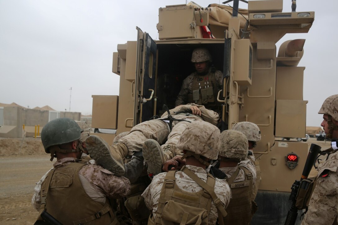 Marines and Navy corpsmen with Headquarters and Service Company, 1st Battalion, 7th Marine Regiment, evacuate a simulated casualty during a training drill aboard Camp Leatherneck, Afghanistan, March 14, 2014. The drill was designed to ensure accountability of all personnel and gear while practicing movement to muster locations in the event of an emergency. The battalion had Navy corpsmen with 3rd Battalion, 7th Marine Regiment, evaluate the service members as they reacted to the situation. “I think it was vital to establish a baseline of our reactions,” said Petty Officer 1st Class Jeson Hall, a corpsman with 1st Bn., 7th Marines, and a native of Florence, Ala. “Establishing a baseline give us measures for success so we can continue to improve during future drills.” (U.S. Marine Corps photo by Cpl. Joseph Scanlan)