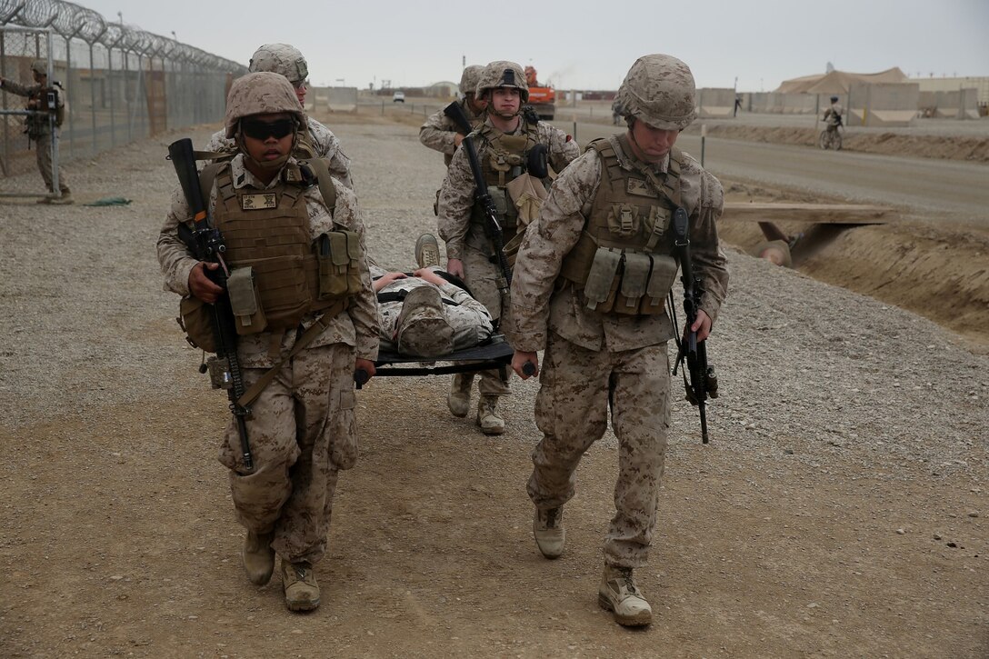 Marines and Navy corpsmen with Headquarters and Service Company, 1st Battalion, 7th Marine Regiment, evacuate a simulated casualty during a training drill aboard Camp Leatherneck, Afghanistan, March 14, 2014. The drill was designed to ensure accountability of all personnel and gear while practicing movement to muster locations in the event of an emergency. The battalion had Navy corpsmen with 3rd Battalion, 7th Marine Regiment, evaluate the service members as they reacted to the situation. “I think it was vital to establish a baseline of our reactions,” said Petty Officer 1st Class Jeson Hall, a corpsman with 1st Bn., 7th Marines, and a native of Florence, Ala. “Establishing a baseline give us measures for success so we can continue to improve during future drills.” (U.S. Marine Corps photo by Cpl. Joseph Scanlan)