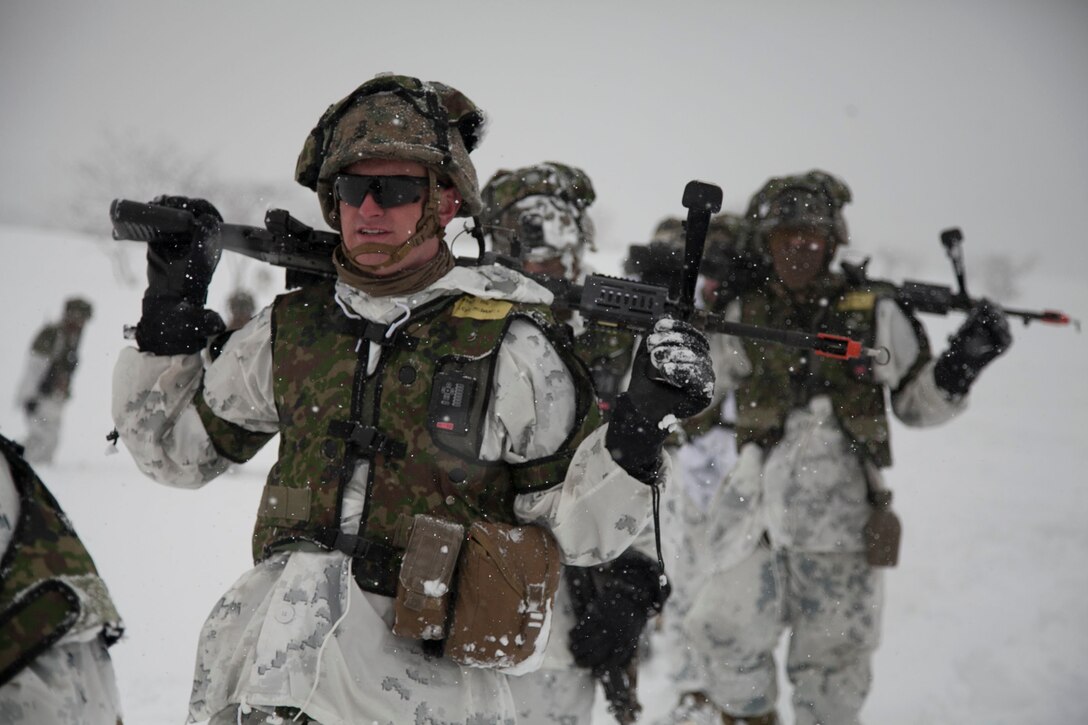 Marines patrol through snow March 6 during a culminating field event for Exercise Forest Light 14-2 at Sekiyama Training Area in Niigata prefecture, Japan. The three-day field training tested the cold-weather tactics and survival skills learned throughout the training. The Marines are with Company I, 3rd Battalion, 1st Marine Regiment, currently assigned to 4th Marines, 3rd Marine Division, III Marine Expeditionary Force, under the unit deployment program. 