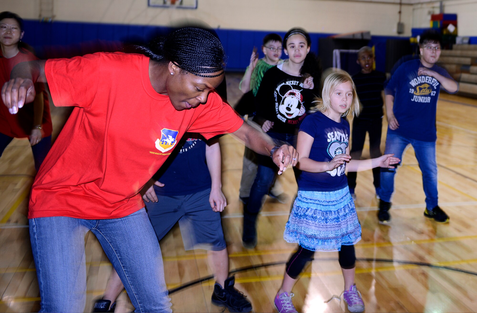 Children participate in a group dance led by Captain Emily McElveen, 51st Medical Group pediatrican, during a Healthy Habits Program at the Youth Center at Osan Air Base, Republic of Korea, March 19, 2014. The Healthy Habits Program was a five-week course offered by the 51st MDG with the assistance of base volunteers to teach children about making healthy decisions and McElveen is the program director. (U.S. Air Force photo/Tech. Sgt. Micky M. Bazaldua)