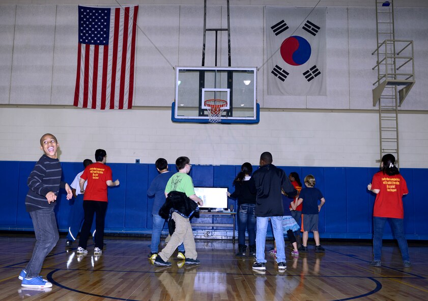 Children participate in a group dance during a Healthy Habits Program at the Youth Center at Osan Air Base, Republic of Korea, March 19, 2014. The Healthy Habits Program was a five-week course offered by the 51st Medical Group with the assistance of base volunteers to teach children about making healthy decisions. (U.S. Air Force photo/Tech. Sgt. Micky M. Bazaldua)