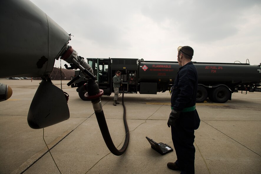Airman 1st Class Kesten Accomando, a 25th Fighter Squadron crew chief, and Airman 1st Class Robert Youngs, a 51st Logistic Readiness Squadron fuels operator, track the refueling process on an A-10 March 18, 2014, at Osan Air Base, Republic of Korea. Kesten, Youngs refuel aircraft everyday as part of their duties. (U.S. Air Force photo by Staff Sgt. Jake Barreiro)