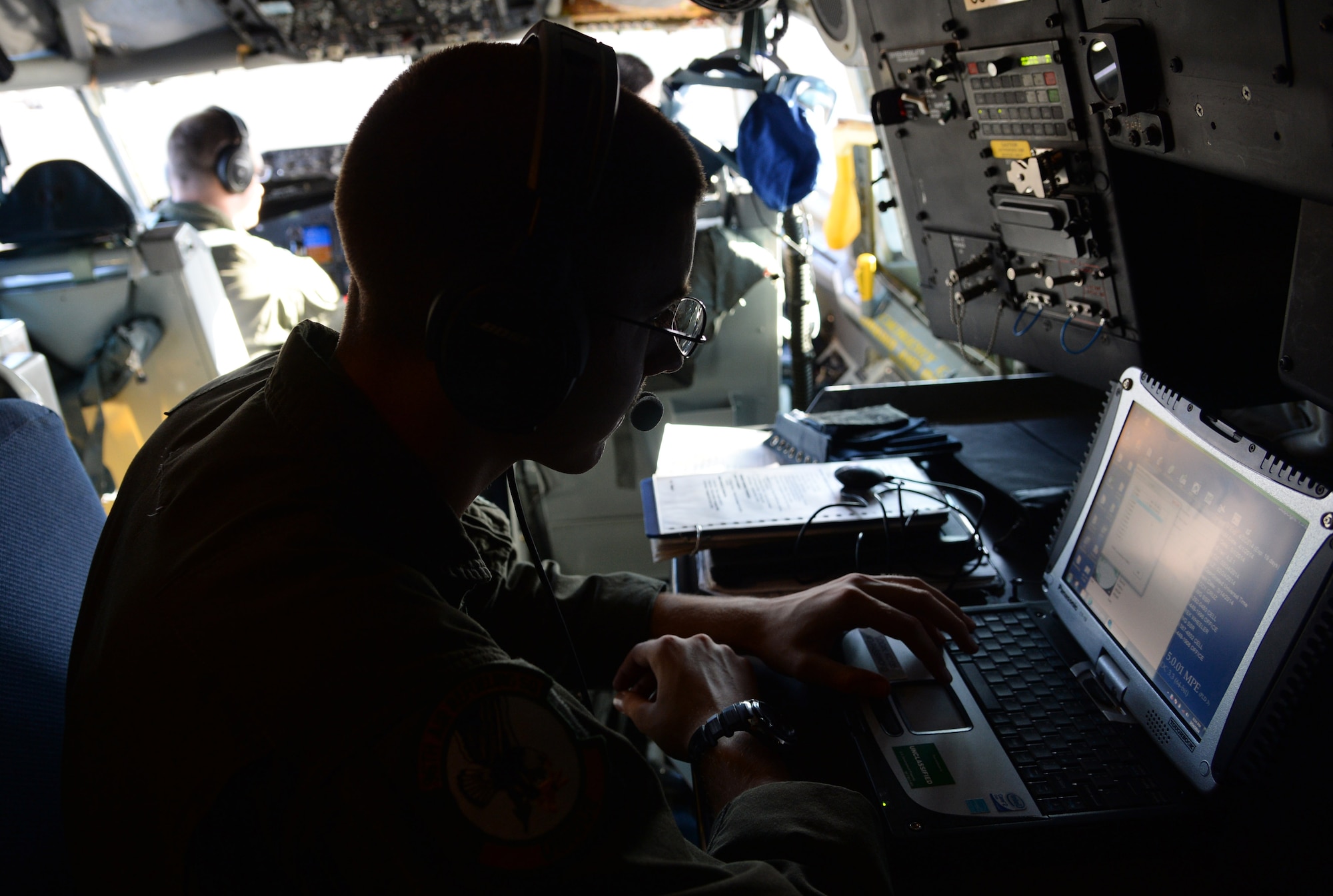 Airman 1st Class Scott Willard, 96th Air Refueling Squadron boom operator, prepares his data equipment before a refueling mission flight aboard a KC-135 Stratotanker near Joint Base Pearl Harbor-Hickam, Hawaii, March 14, 2014. Willard and his crew participated in a Warrior Day training exercise as part of Sentry Aloha, an air-to-air exercise that allowed participants to practice offensive and defensive wartime tactics. (U.S. Air Force photo/Staff Sgt. Alexander Martinez)