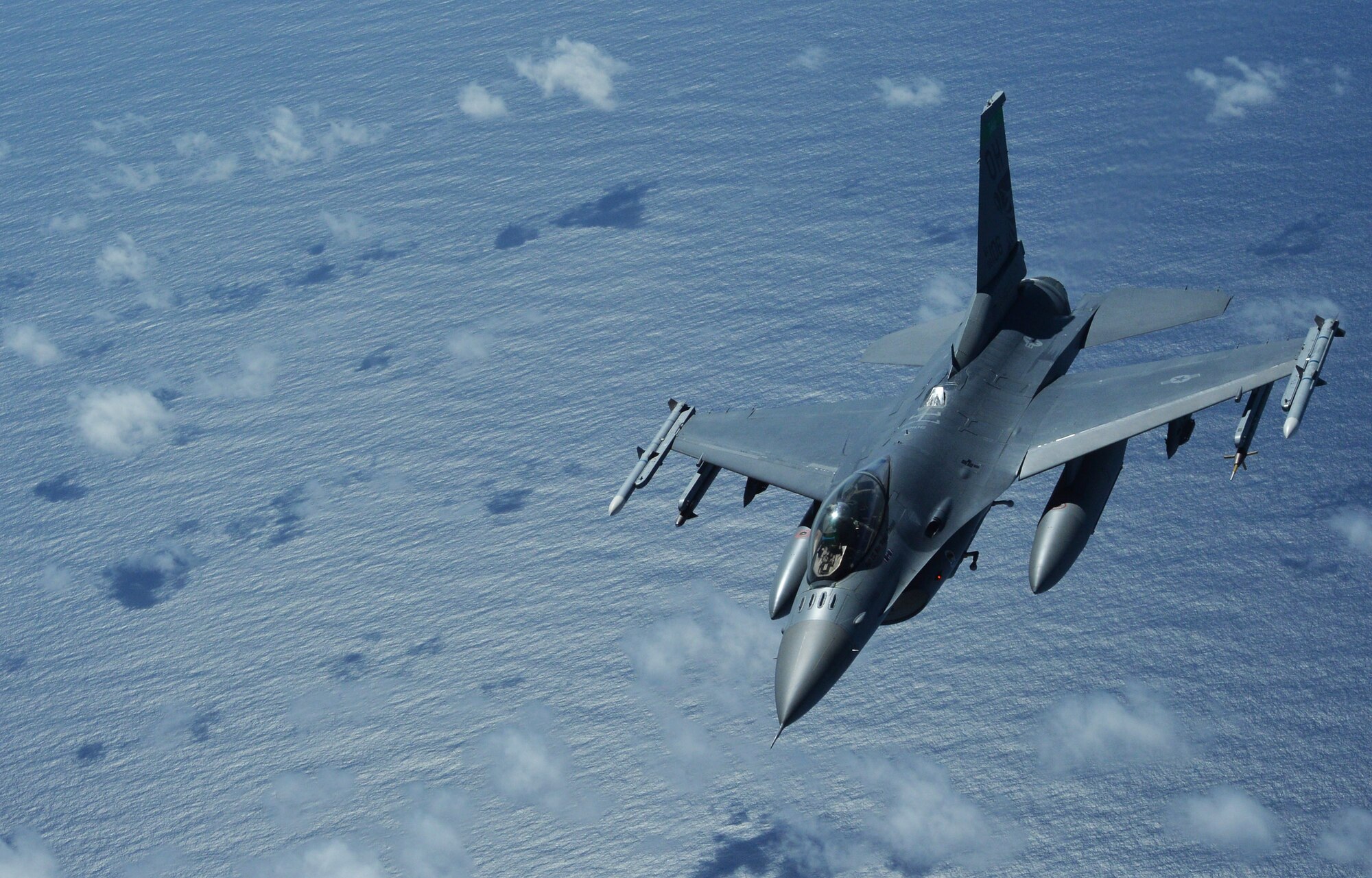 An Ohio Air National Guard F-16 Fighting Falcon falls back in formation after an in-air refueling near Joint Base Pearl Harbor-Hickam, Hawaii, March 14, 2014. The F-16 participated in a Warrior Day training exercise as part of Sentry Aloha, an air-to-air exercise that allowed participants to practice offensive and defensive wartime tactics. (U.S. Air Force photo/Staff Sgt. Alexander Martinez)