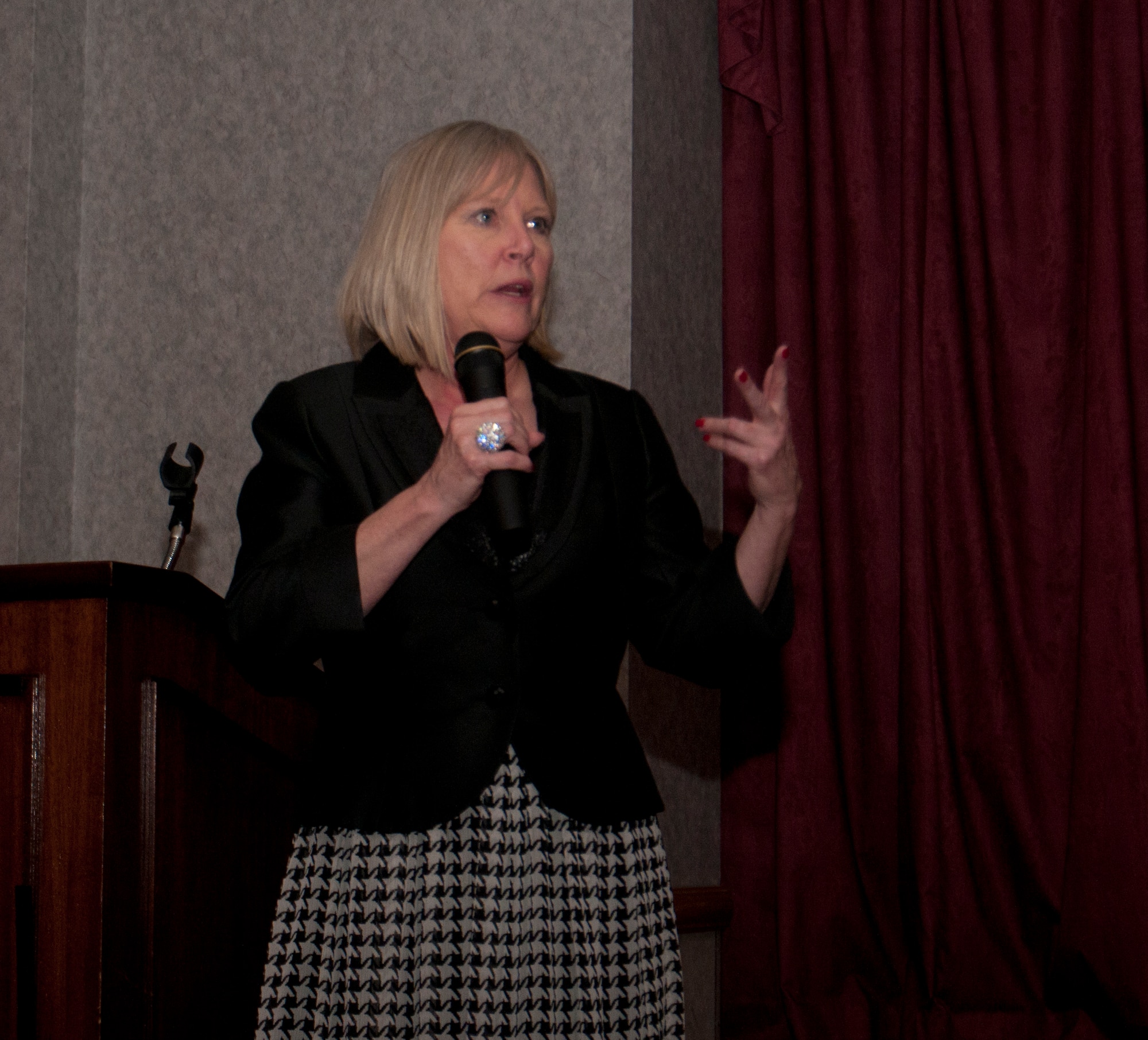 Suzie Schwartz, military family advocate and wife of former Air Force Chief of Staff, Gen. (Ret.) Norton A. Schwartz, delivers the keynote speech at the 8th Annual Warren Spouses Club Basket Auction & Masquerade March 15, 2014, in the Trail’s End Club. Schwartz stressed the importance of active spouse participation in Air Force life. (U.S. Air Force photo by Airman 1st Class Jason Wiese)