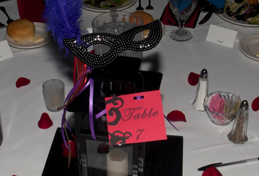 Masks, candles and flower petals provide atmosphere to the 8th Annual Warren Spouses Club Basket Auction & Masquerade March 15, 2014, in the Trail’s End Club. (U.S. Air Force photo by Airman 1st Class Jason Wiese)