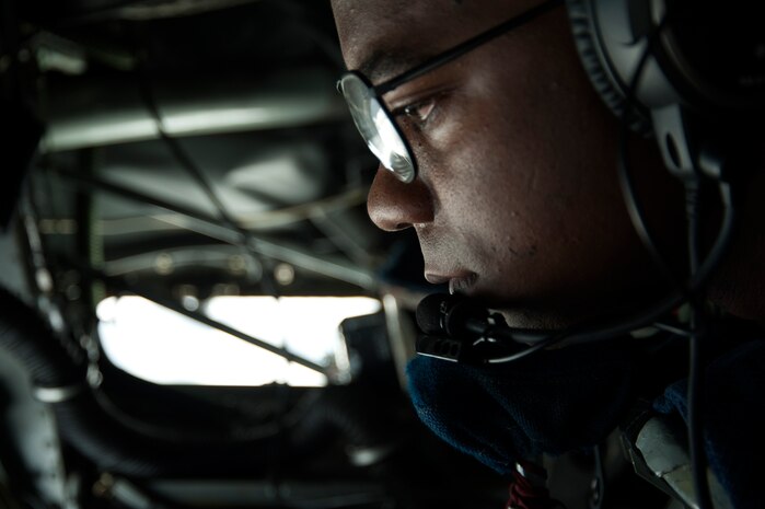 U.S. Air Force Staff Sgt. Bobby Jackson, 350th Air Refueling Squadron boom operator, refuels incoming aircraft during Red Flag 14-2 over the Nevada Test and Training Range March 13, 2014.  Boom operators communicate with pilots in the aircraft being refueled in order to safely line up the boom during fuel exchanges. The experiences gained during Red Flag are intended to improve the chance of success for aircrews in combat. (U.S. Air Force photo by Airman 1st Class Timothy Young)