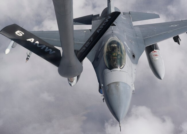 An F-16 Fighting Falcon approaches a KC-135 Stratotanker for refueling during Red Flag 14-2 March 13, 2014 over the Nevada Test and Training Range.  During Red Flag, mid-air re-fueling allows aircraft to save time and quickly get back into the fight, without having to return to  the ground to refuel. (U.S. Air Force photo by Airman 1st Class Timothy Young)