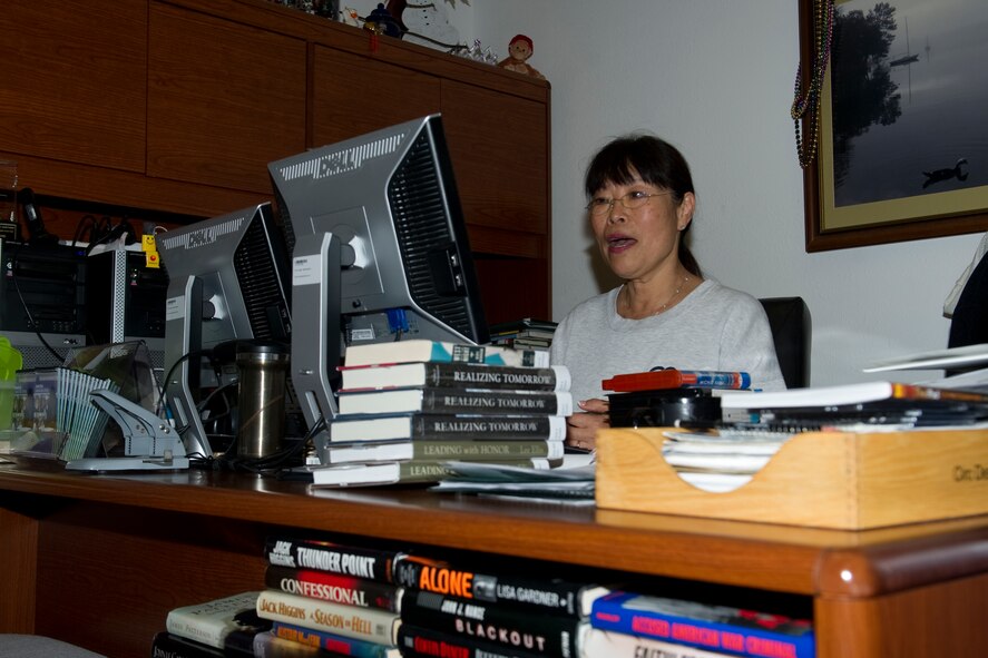 Lilly Woods, 1st Special Operations Force Support Squadron base library cataloger, looks up how many books the library houses at Hurlburt Field, Fla., March 18, 2014. Woods said in the last 30 days the library served more than 5,900 patrons. (U.S. Air Force photo/Senior Airman Naomi Griego)  