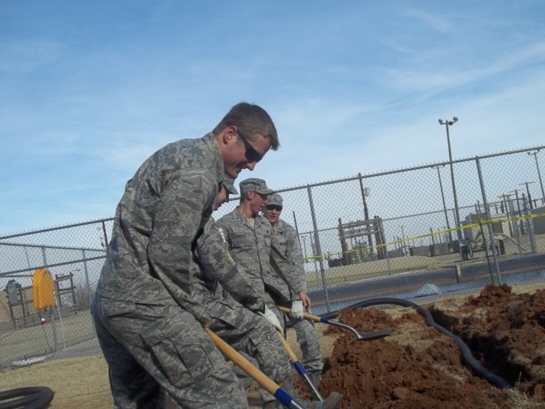 2nd Lieutenants Logan Mitchell, Colton Wetzel, Matt Major, Jack Ladd and Steven Lawrence installed the base’s first Rainwater harvesting system, located behind building 1921. Mitchell, a student pilot with the 80th Flying Training Wing, designed and built the rainwater harvesting system. He worked for the 82nd Civil Engineer Squadron while awaiting his pilot training start date. (courtesy photo) 
