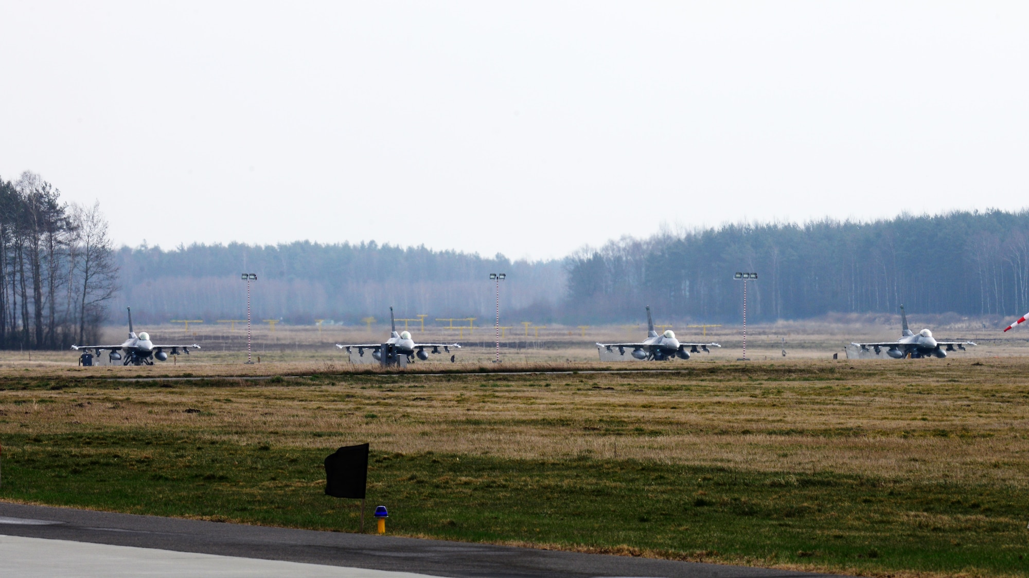 Four 555th Fighter Squadron F-16 Fighting Falcons prepare to takeoff for a training mission, March 18, 2014, at Lask Air Base, Poland. The aerial training exercises a pilot’s ability to operate across a range of military operations with precise full-spectrum capabilities. (U.S. Air Force photo/Airman 1st Class Ryan Conroy) 