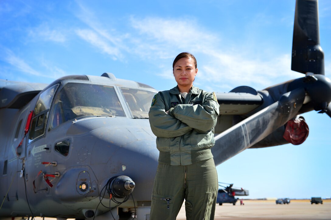 U.S. Air Force Tech. Sgt. Tupe Godinet, 20th Special Operations Squadron CV-22 Osprey flight engineer, poses for a photo on the flightline March 6, 2014 at Cannon Air Force Base, N.M.  Godinet is one of two female flight engineers within the CV-22 Osprey community. (U.S. Air Force photo/ Senior Airman Eboni Reece)