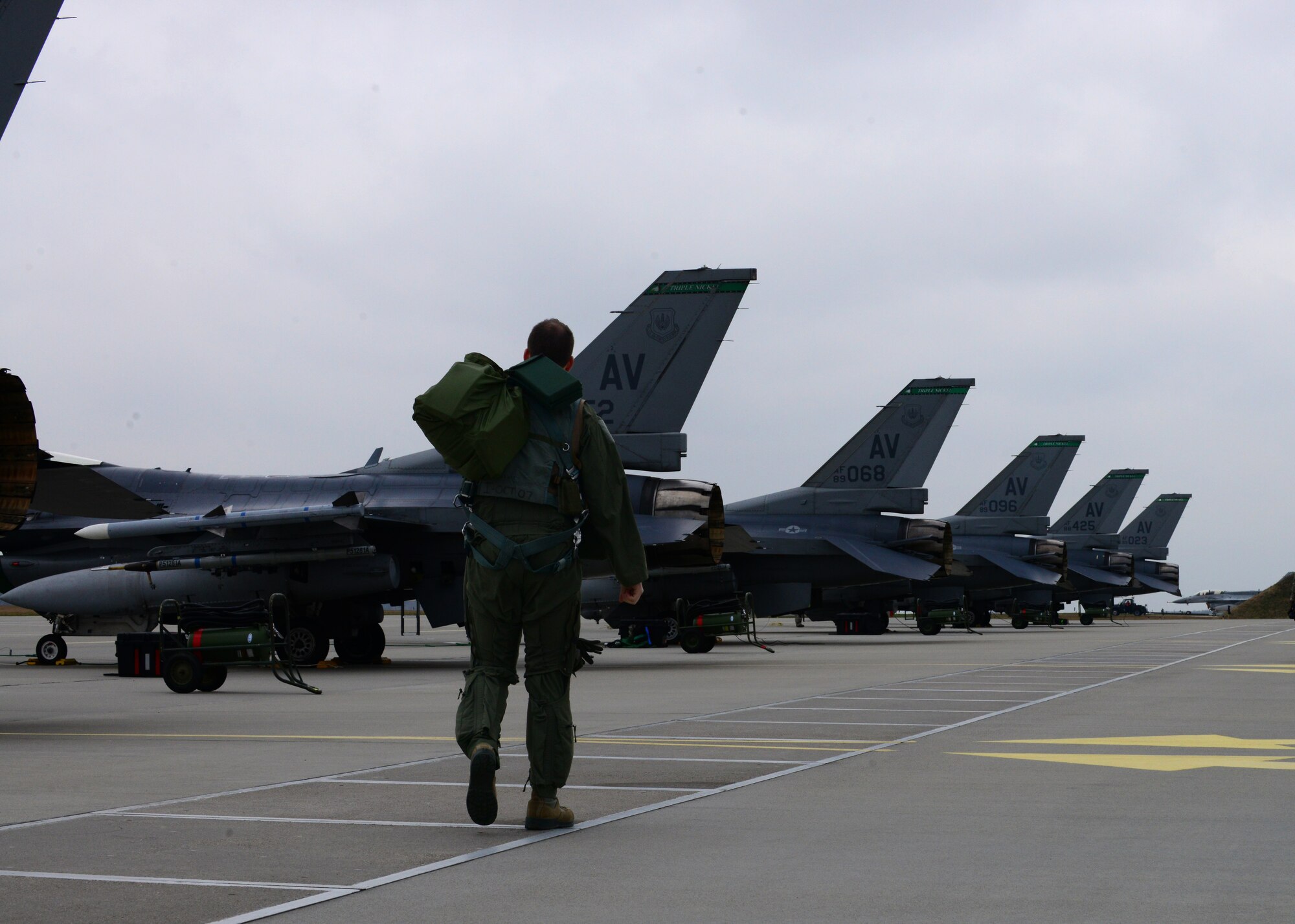 First Lieutenant Matthew Alexander, 555th Fighter Squadron pilot, steps out to his F-16 Fighting Falcon before a training mission, March 18, 2014, at Lask Air Base, Poland. The aerial training exercises a pilot’s ability to operate across a range of military operations with precise full-spectrum capabilities. (U.S. Air Force photo/Airman 1st Class Ryan Conroy) 
