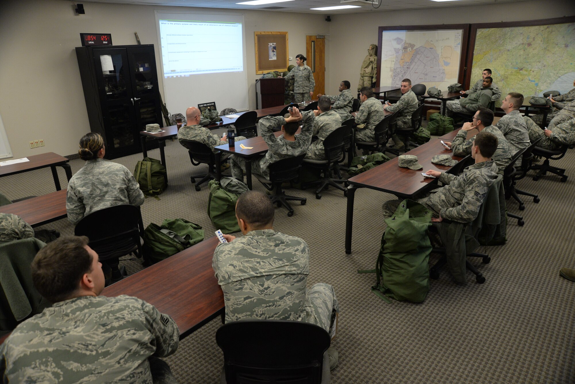 Team Shaw Airmen take a test finishing up the class room portion of the chemical, biological, radioactive, and nuclear training, Shaw Air Force Base, S.C., March 18, 2014. The Airmen spent time reviewing proper use of mission oriented protective posture gear, alarm signals, and other CBRN related situations. (U.S. Air Force photo by Airman 1st Class Michael A. Cossaboom/Released) 