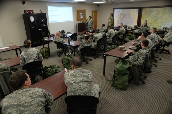 Team Shaw Airmen take a test to finish up the classroom portion of chemical, biological, radioactive and nuclear training, Shaw Air Force Base, S.C., March 18, 2014. The Airmen spent time reviewing proper use of mission oriented protective posture gear, alarm signals, and other CBRN related situations. (U.S. Air Force photo by Airman 1st Class Michael A. Cossaboom/Released) 