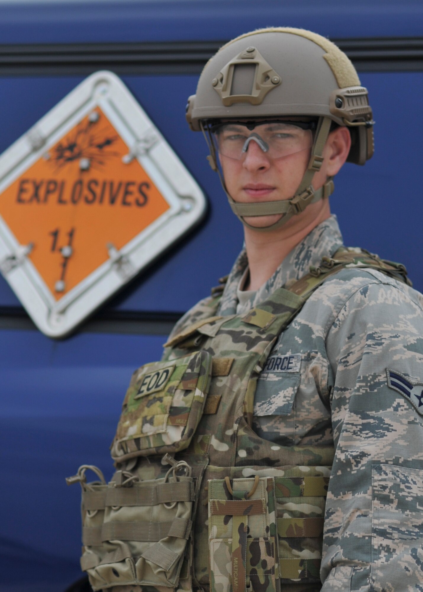 An Airman with the 1st Special Operations Civil Engineer Squadron explosive ordnance disposal stands by an EOD truck at Perdido Key, Fla., March 12, 2014. EOD members disposed of unexploded ordinance on-site when UXOs are unsafe for transport on public roadways. (U.S. Air Force Photo/Staff Sgt. John Bainter)