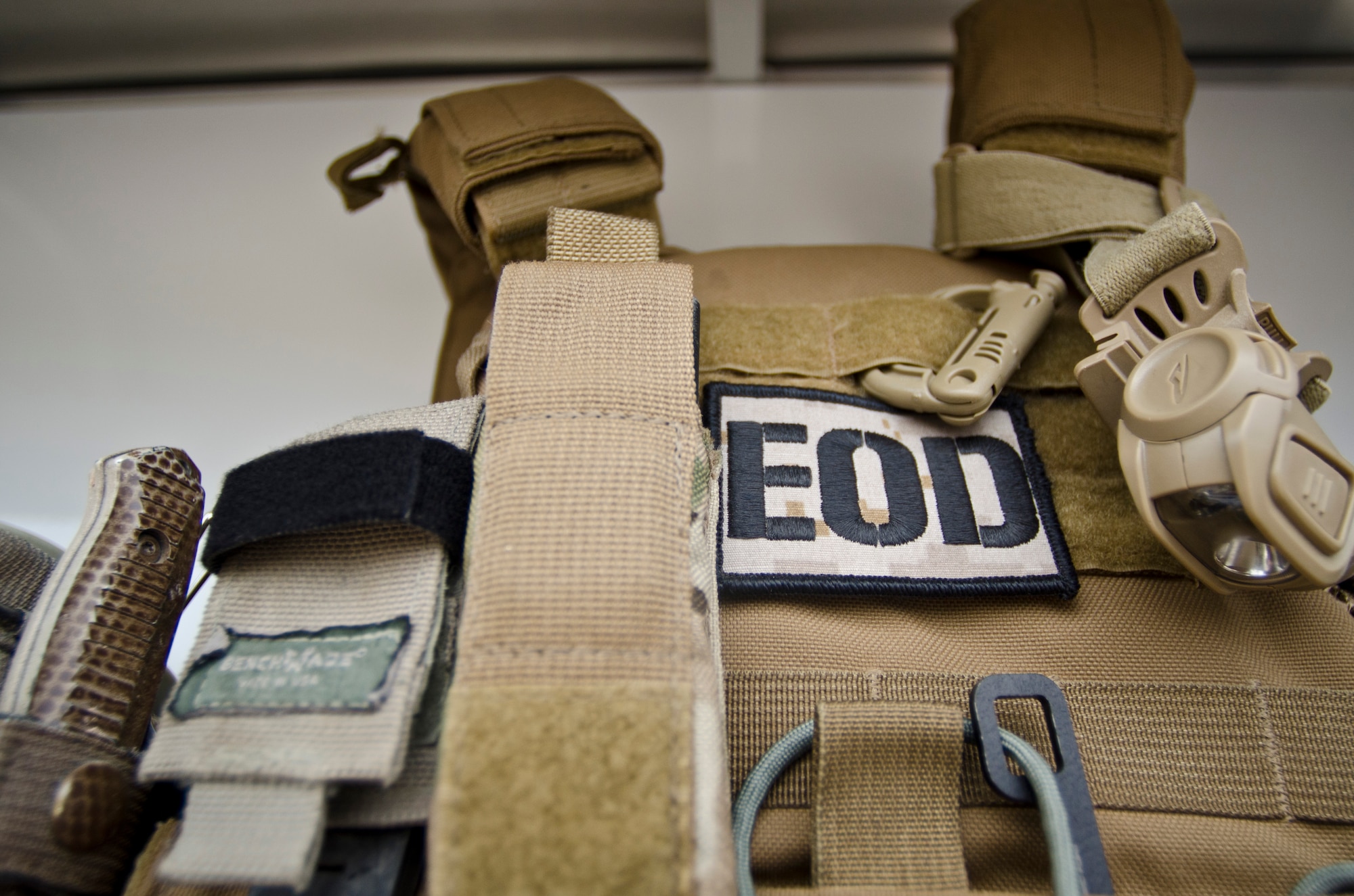 Body armor adorned with an explosive ordnance disposal patch sits in a truck at Perdido Key, Fla., March 12, 2014. EOD Airmen use body Armor as personal protective equipment and it’s required when handling or disposing of ordnance. (U.S. Air Force photo/Staff Sgt. John Bainter)