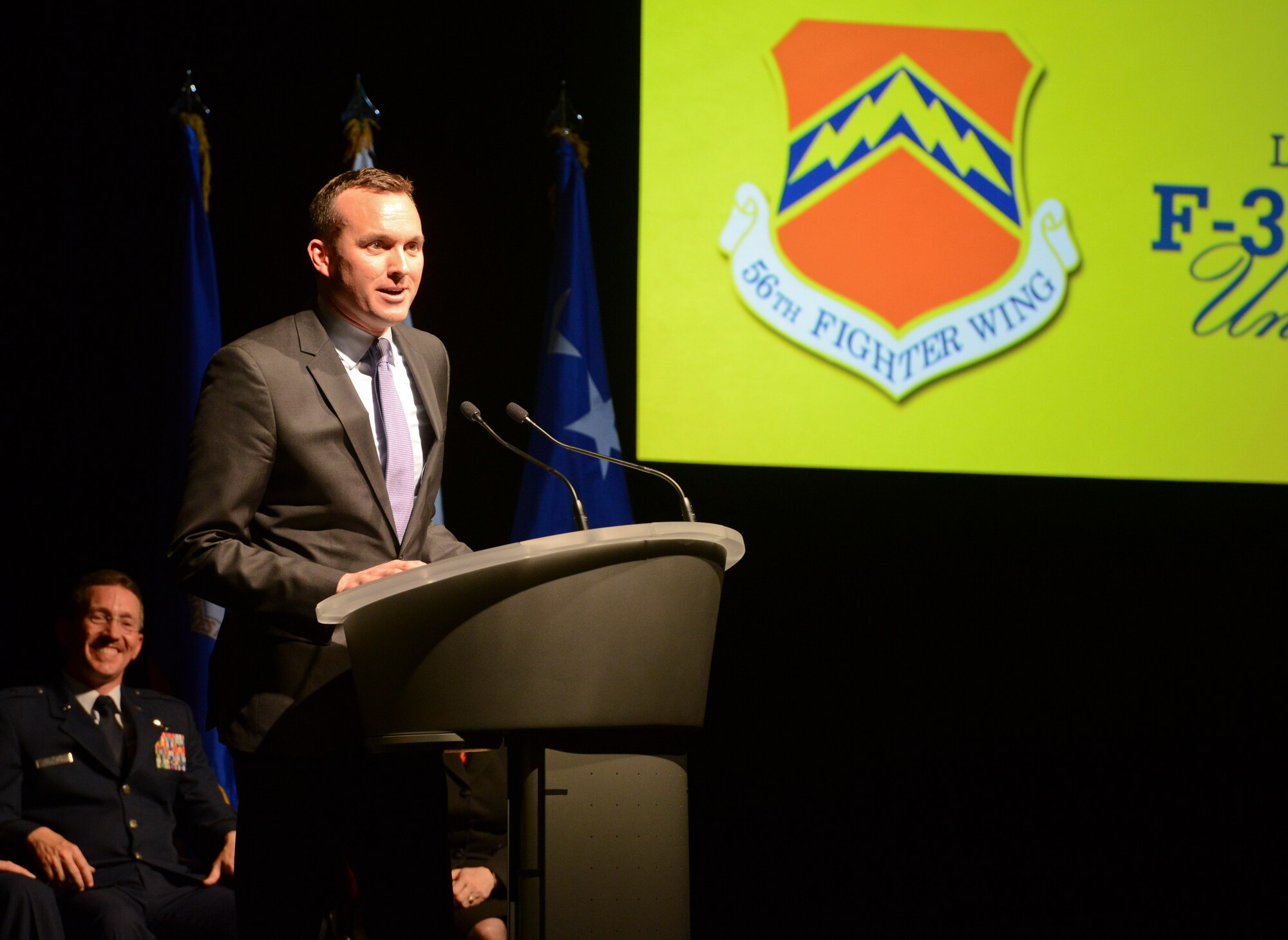 Undersecretary of the Air Force Eric Fanning addresses an audience of approximately 500 community leaders, elected officials, representatives from partner nation air forces and Luke Airmen during an unveiling ceremony on March 14 at Luke Air Force Base for the 56th Fighter Wing’s first F-35 Lightning II fighter jet. On the stage in the background is Brig. Gen. Mike Rothstein, 56th Fighter Wing commander. “Today's ceremony embodies, to me, commitment,” Fanning said. “For the Air Force it represents our commitment to the F-35. This weapons system is critical for the Air Force continuing to provide decisive air superiority around the world. This fighter will dominate anything else, anywhere in the world that any other country produces.” (U.S. Air Force photo by Senior Airman Devante Williams)