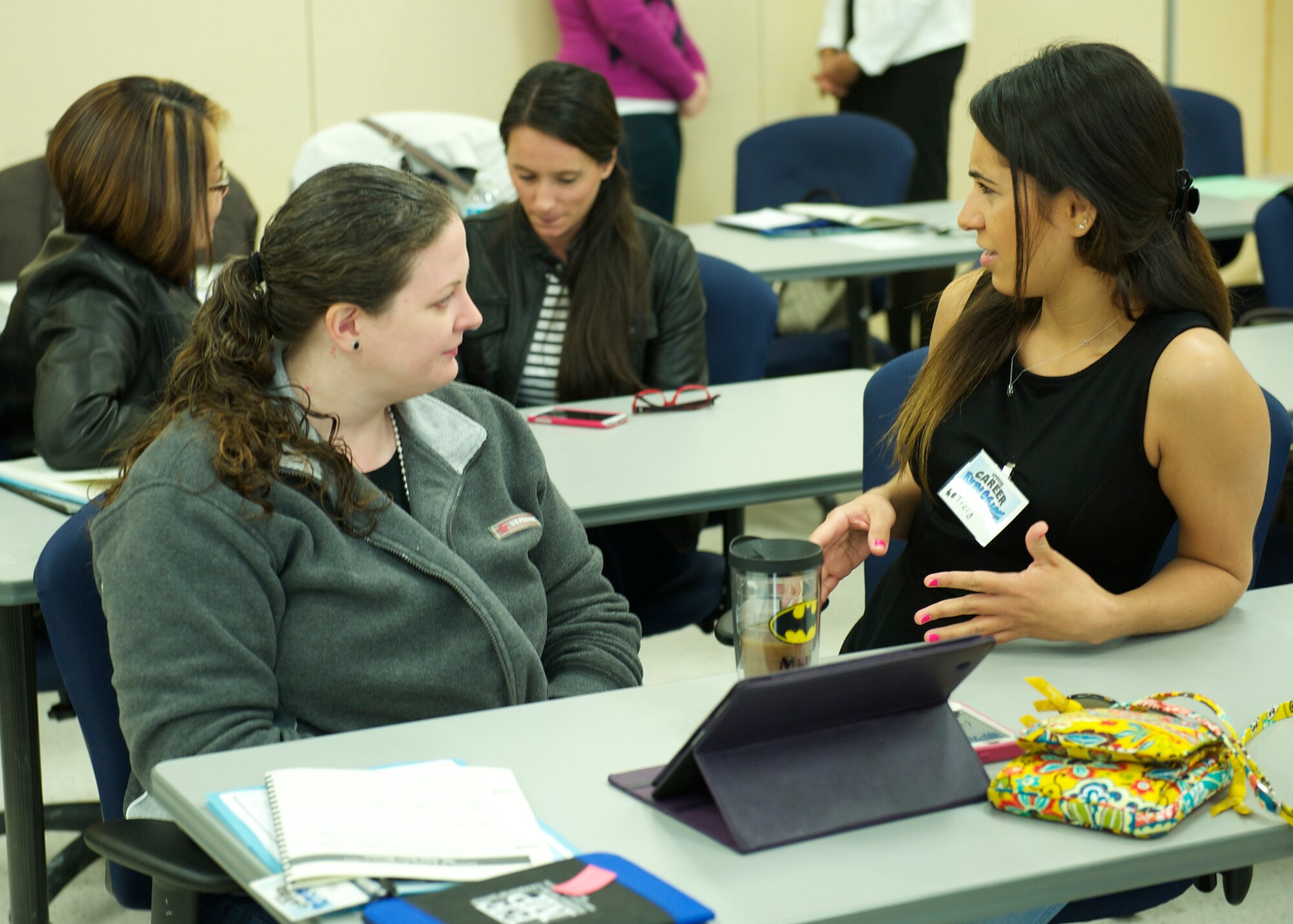 Two military spouses practice introductions as part of the "Interviewing Basics" session during the Spouse Career Explosion March 13 at Eglin Air Force Base, Fla. The two-day event was hosted by the Airman and Family Readiness Center for military spouses seeking employment and career resources in order to compete in today’s job market. (U.S. Air Force photo/Sara Vidoni)