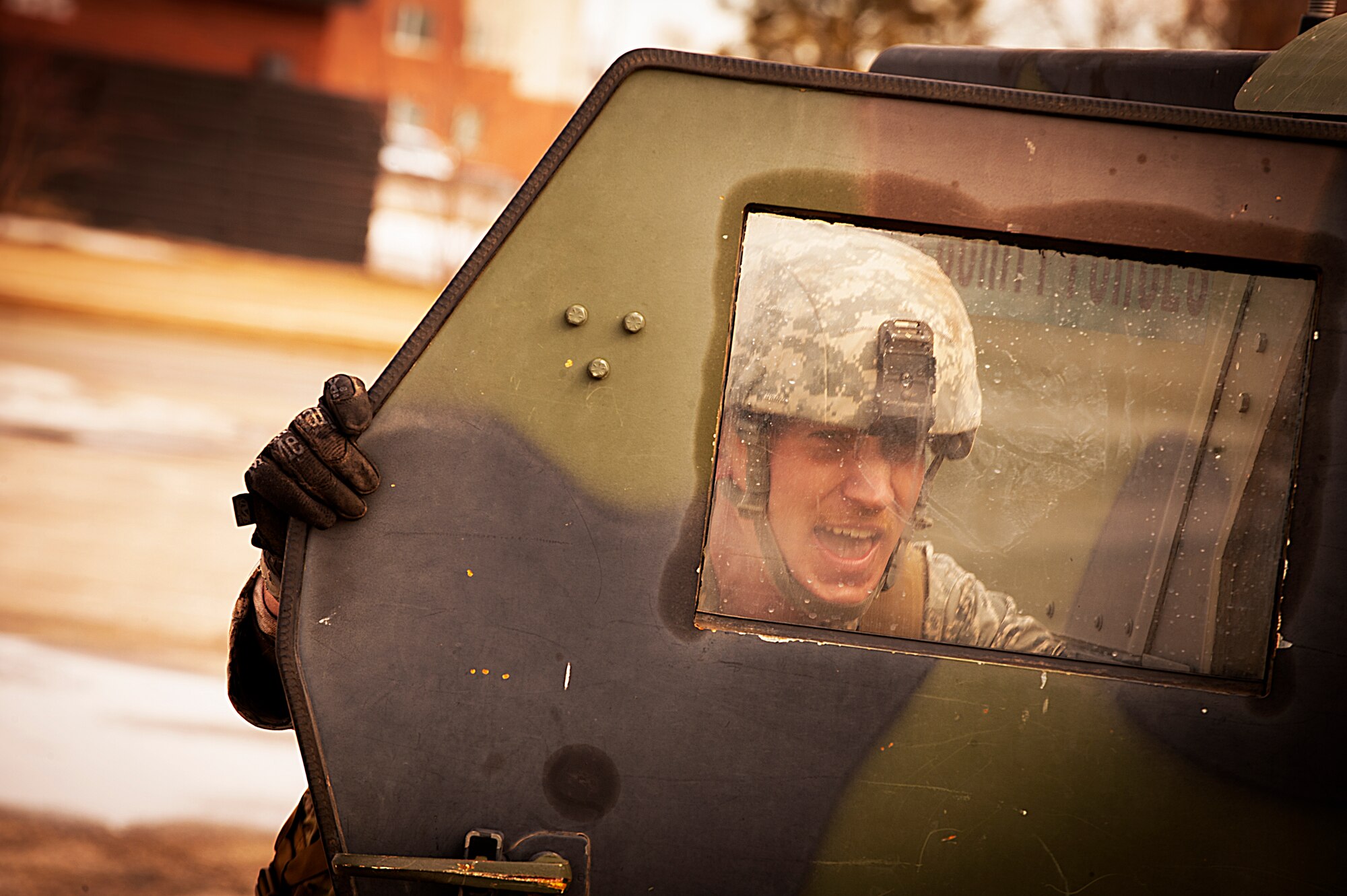 Tech. Sgt. Mitchell Stein, 91st Missile Security Forces Squadron defender, pushes a Humvee during the Top Dog competition at Minot Air Force Base, N.D., March 12, 2014. The 91st MSFS holds the completion quarterly as a way to boost morale throughout the squadron. (U.S. Air Force photo/Airman 1st Class Apryl Hall)