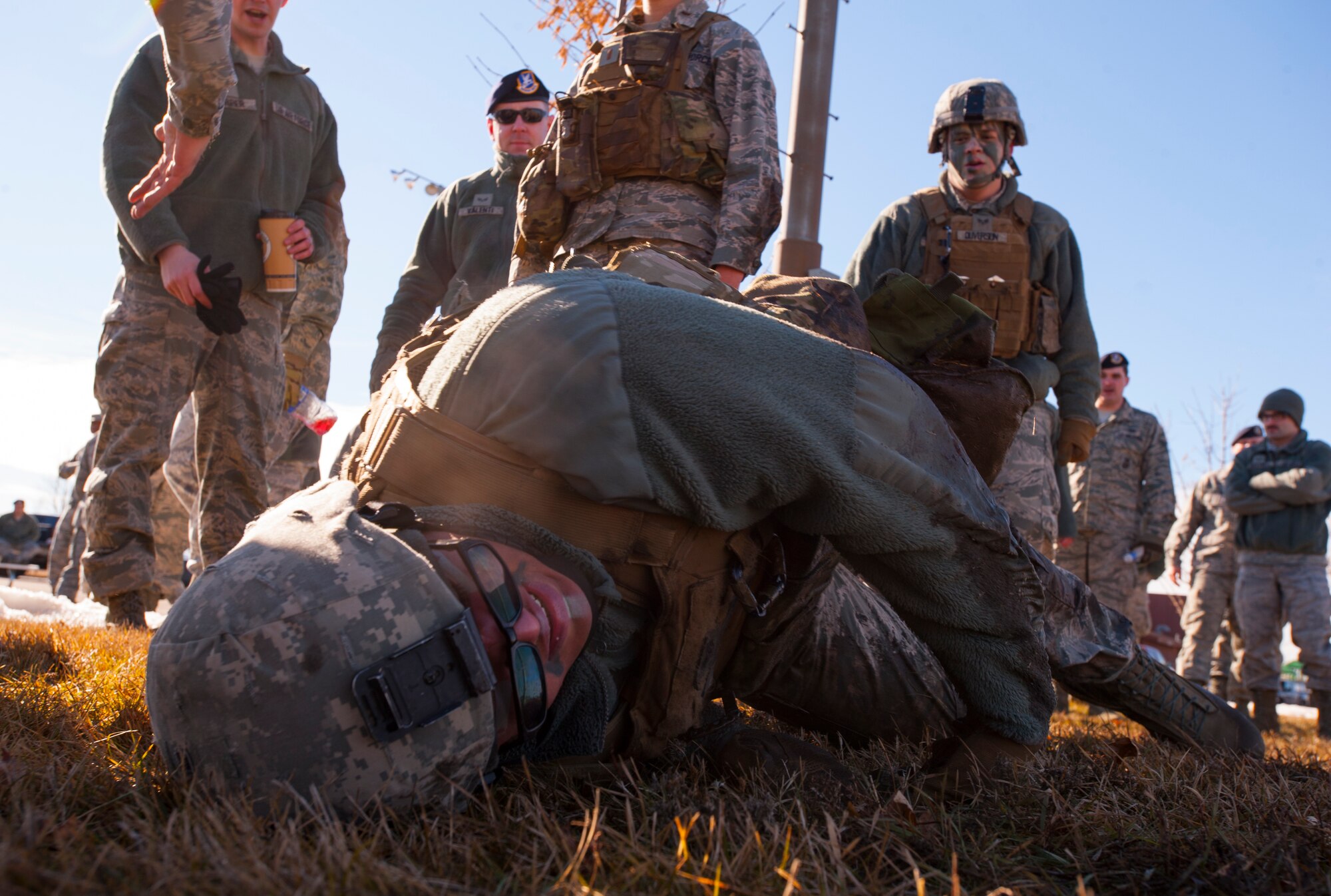 Senior Airman Aaron Bowser, 91st Missile Security Forces Squadron defender, catches his breath after a Top Dog competition event at Minot Air Force Base, N.D., March 12, 2014. The friendly competition allows defenders to practice training techniques while boosting morale. (U.S. Air Force photo/Airman 1st Class Apryl Hall)