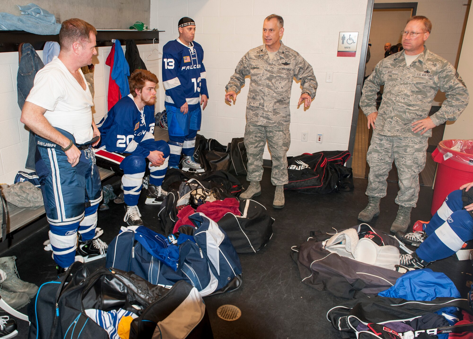 Col. Daniel Swain pumps up his team before a Blue vs. White hockey matchup at Eastern Washington University’s University Recreation Center in Cheney, Wash., March 14, 2014. Swain is the 141st Air Refueling Wing commander. (U.S. Air Force photo by Staff Sgt. Benjamin W. Stratton/Released)