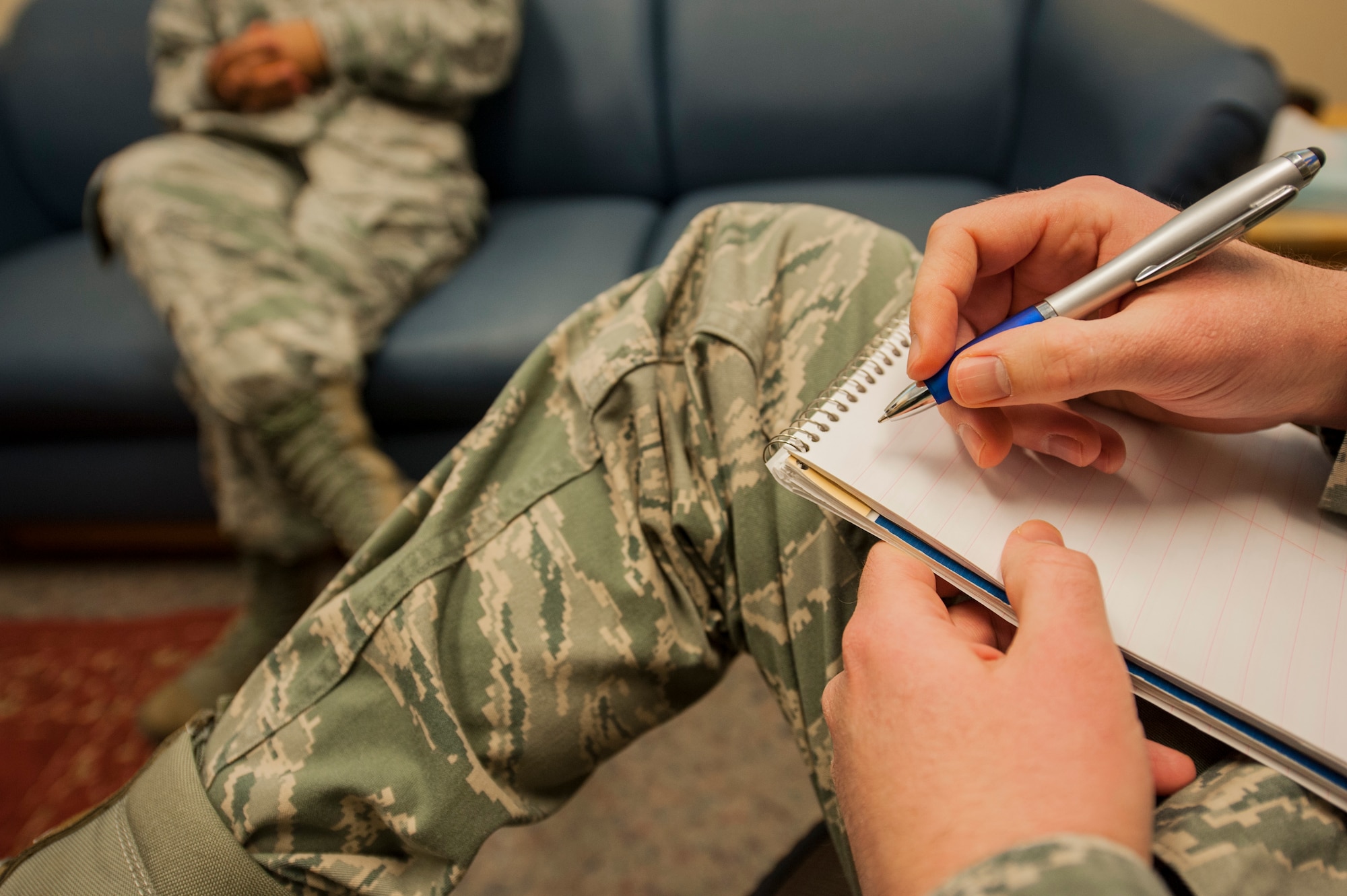 Capt. Tim Ralston, 5th Medical Group mental health element leader, speaks with a patient in his office at Minot Air Force Base, N.D., March 10, 2014. The mental health clinic offers classes to deal with stress such as stress and anger management, divorce classes, sleep hygiene, the five love languages and parenting techniques. All of the classes offered are led by health care professionals proficient in the topic being covered. (U.S. Air Force photo/Senior Airman Stephanie Sauberan)