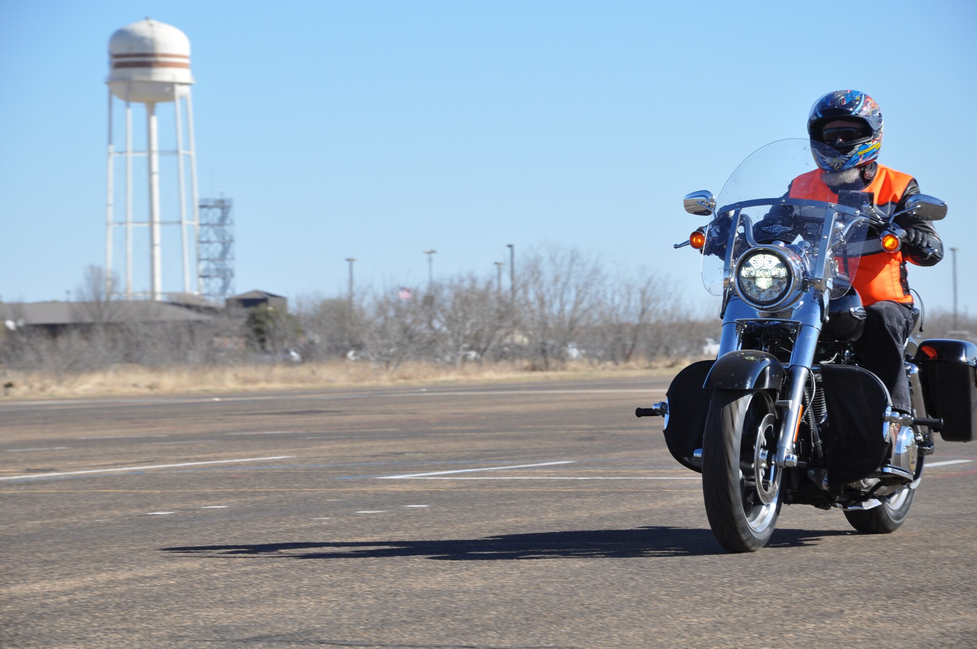 GOODFELLOW AIR FORCE BASE, Texas- Reg Gordon, 17th Training Support Squadron training evaluator and Motorcycle Safety Foundation representative, demonstrates riding techniques during the MSF meeting on Kickapoo Trail here March 17. Gordon performed a figure-eight and a quick-stop on his motorcycle for the attendees promoting riders to practice turning and quick reaction maneuvers. (U.S.  Air Force photo/ Airman 1st Class Erica Rodriguez)