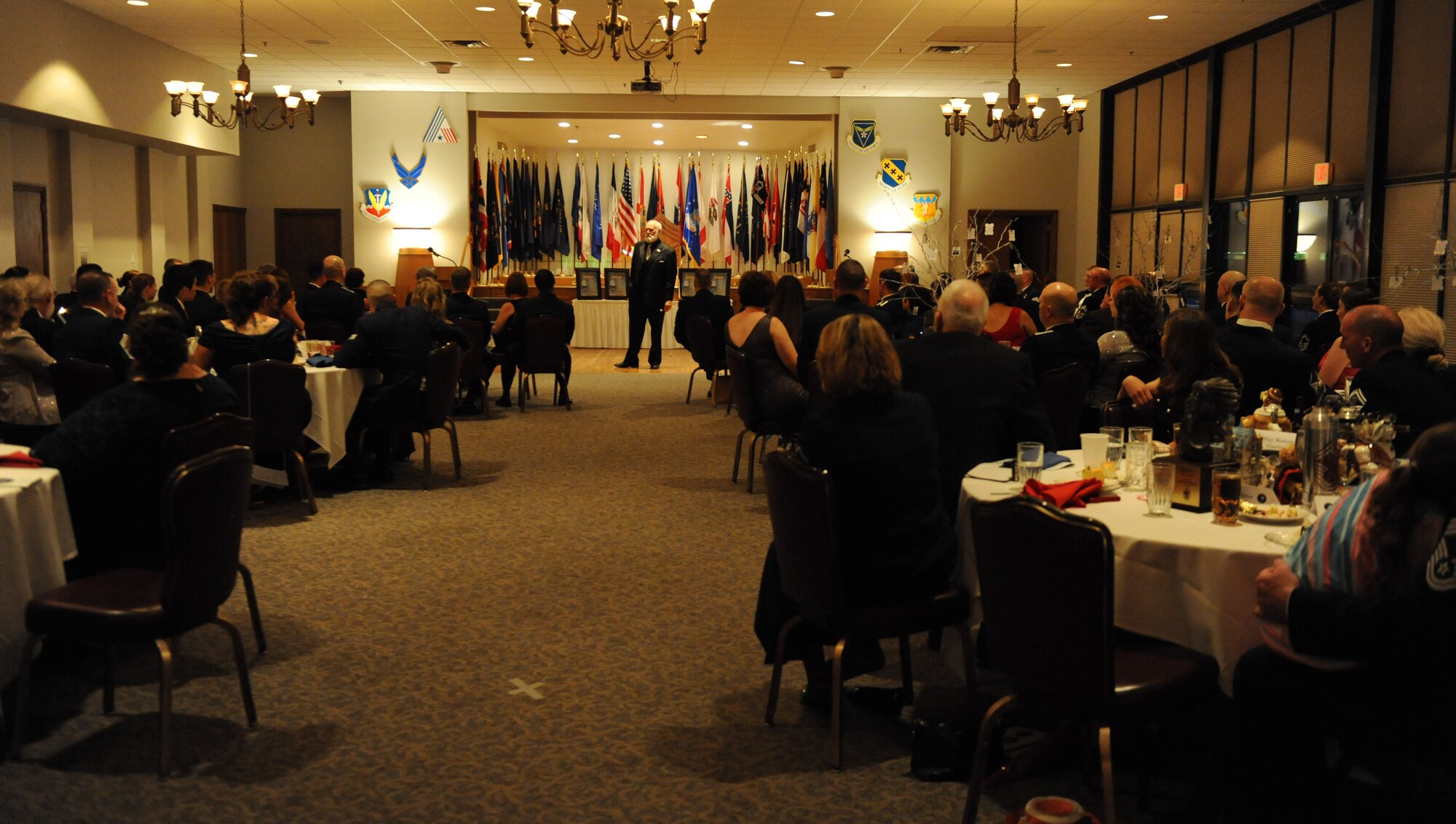 Retired Chief Master Sergeant Terry Savoie, speaks during the Chief Induction Ceremony March 14, 2014 at Dyess Air Force Base, Texas. Savoie was the guest speaker during the event, he touched on the importance of being a leader and the responsibilities that come with being a chief in the Air Force.  The Air Force ensures only the very best noncommissioned officers are promoted to rank of chief master sergeant. (U.S. Air Force photo by Airman 1st Class Autumn Velez/Released)