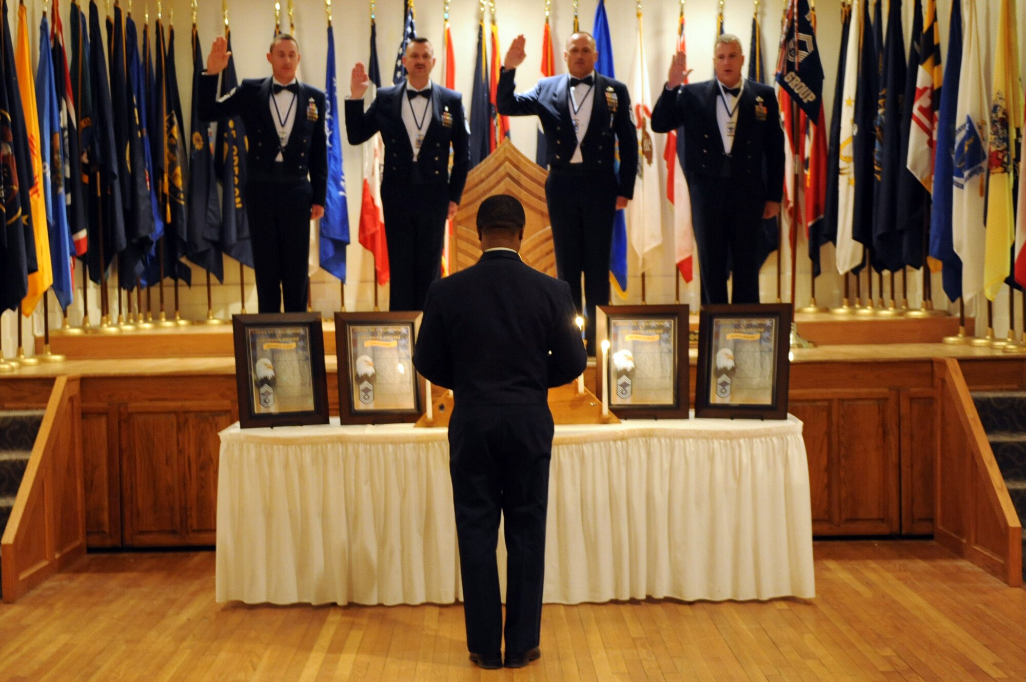 U.S. Air Force Chief Master Sgt. Eddie Webb, 7th Bomb Wing command chief, center, administers the chief master sergeant oath to Dyess’ newest chiefs during the Chief Induction Ceremony March 14, 2014 at Dyess Air Force Base, Texas. The rank of chief master sergeant is the highest enlisted rank in the Air Force, with the exception of the Chief Master Sergeant of the Air Force. (U.S. Air Force photo by Airman 1st Class Autumn Velez/ Released)