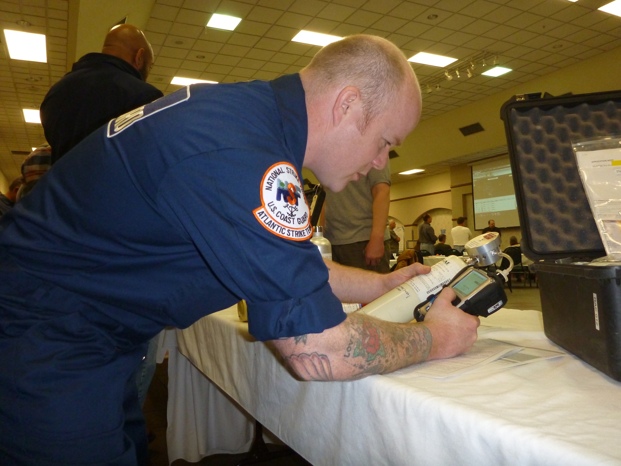 Petty Officer First Class Sean Stone, a response technician with the U.S. Coast Guard Atlantic Strike Team, conducts training with a new piece of equipment used for air monitoring within hazardous atmospheres during an annual exercise on March 11, 2014, in Angola, Ind. (U.S. Coast Guard photo by Petty Officer Second Class Paulina Halasa/Released)
