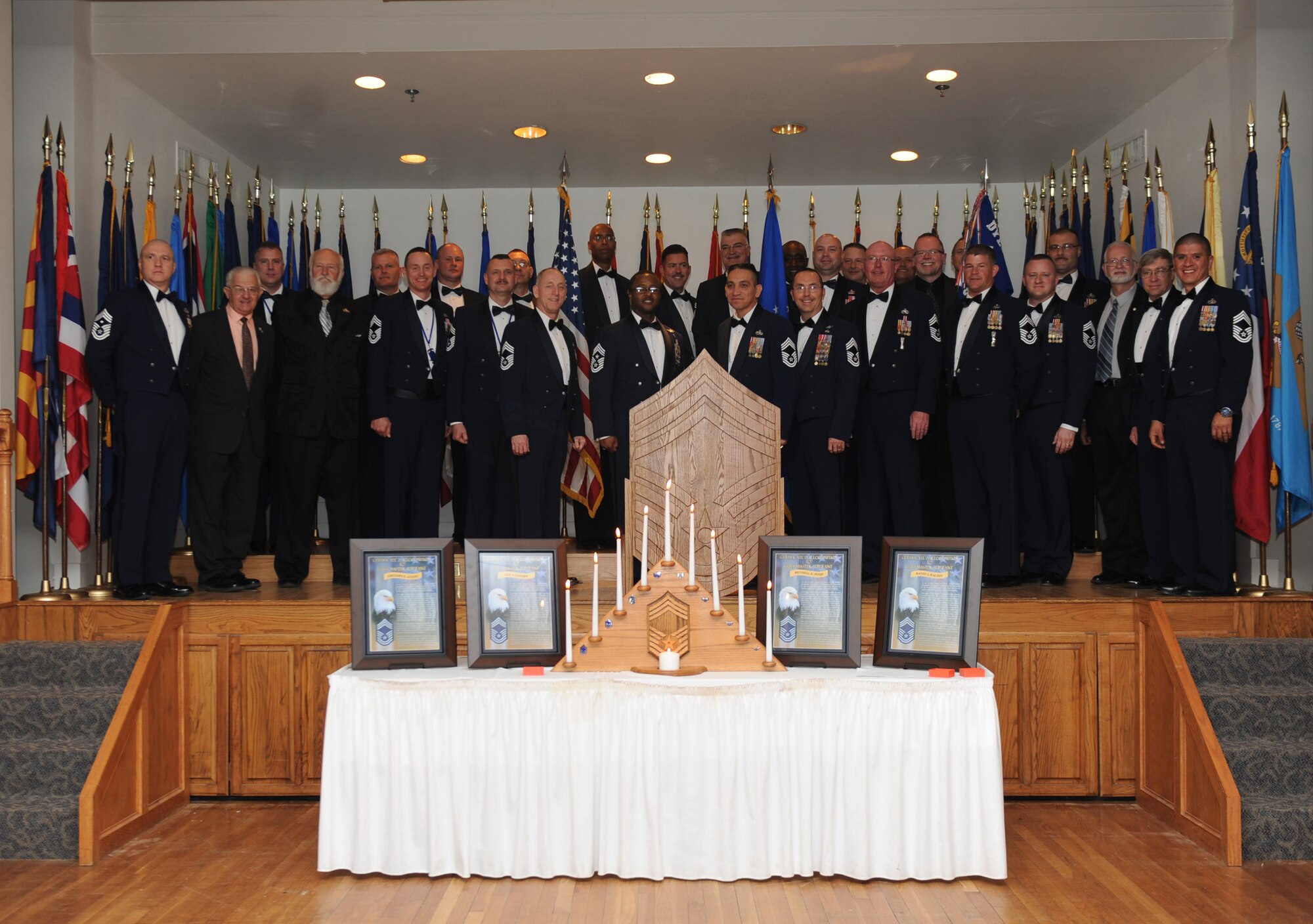 Chief master sergeants of past and present gather to celebrate the induction of the newest additions to the rank of chief master sergeant March 14, 2014 at Dyess Air Force Base, Texas.  By order of congress, only one percent of the enlisted force is allowed to make the rank of chief master sergeant. (U.S. Air Force photo by Airman 1st Class Autumn Velez)